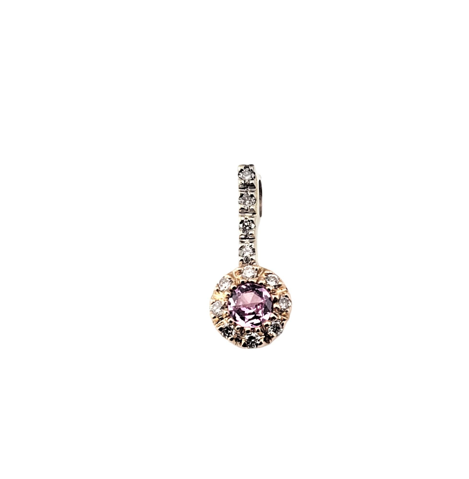 14 Karat Yellow and White Gold Pink Sapphire and Diamond Pendant-

This sparkling pendant features one pink sapphire (.10 ct.) and 12 round brilliant cut diamonds set in 14K yellow and white gold.  

Matching earrings: RL-0007993

Approximate total