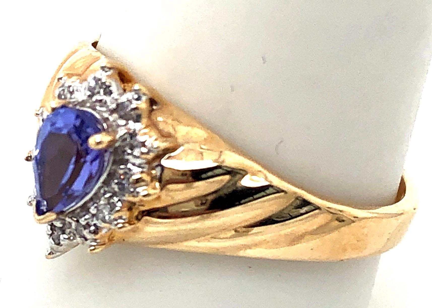 14 Karat Yellow and White Gold Ring Sapphire Solitaire With Diamond Accents 
Size 8.75 .
0.10 total diamond weight.
Pear shaped sapphire
3 grams total weight.