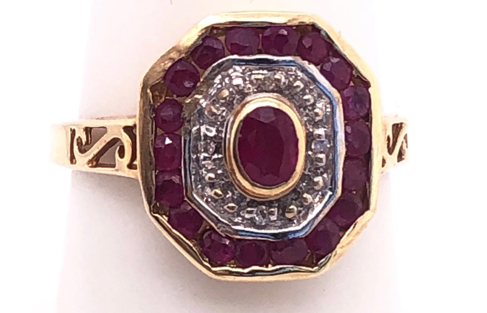 Modern 14 Karat Yellow and White Gold Ruby and Diamond Ring with Side Scroll