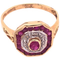 14 Karat Yellow and White Gold Ruby and Diamond Ring with Side Scroll