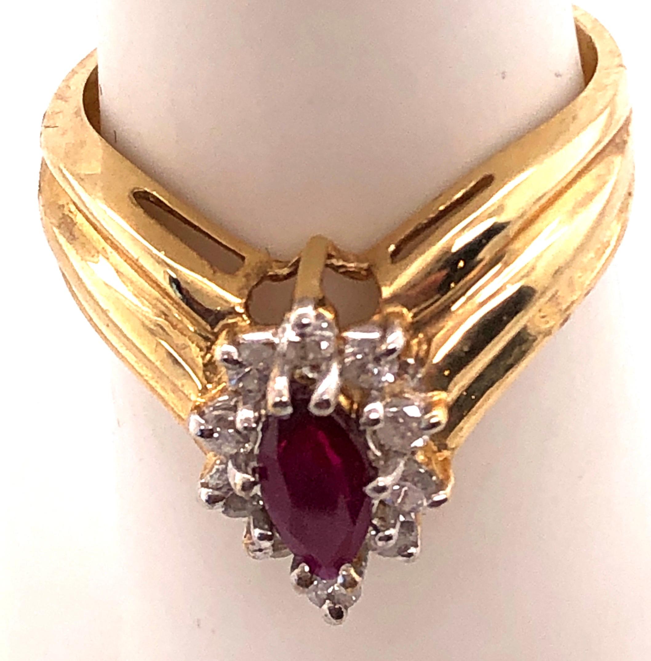 14 Karat Yellow And White Gold Ruby Ring With Diamond Accents 
0.50 TDW.
Size 7
4.43 grams total weight.