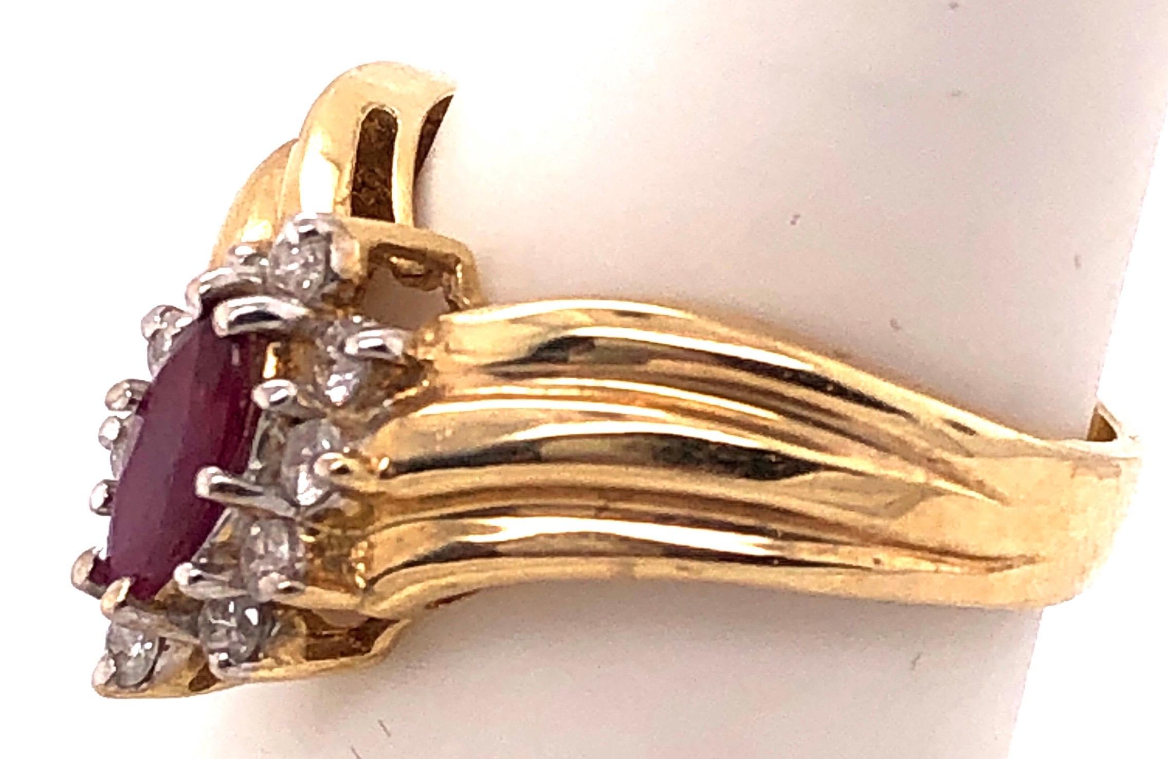 Modern 14 Karat Yellow and White Gold Ruby Ring with Diamond Accents 0.50 TDW For Sale