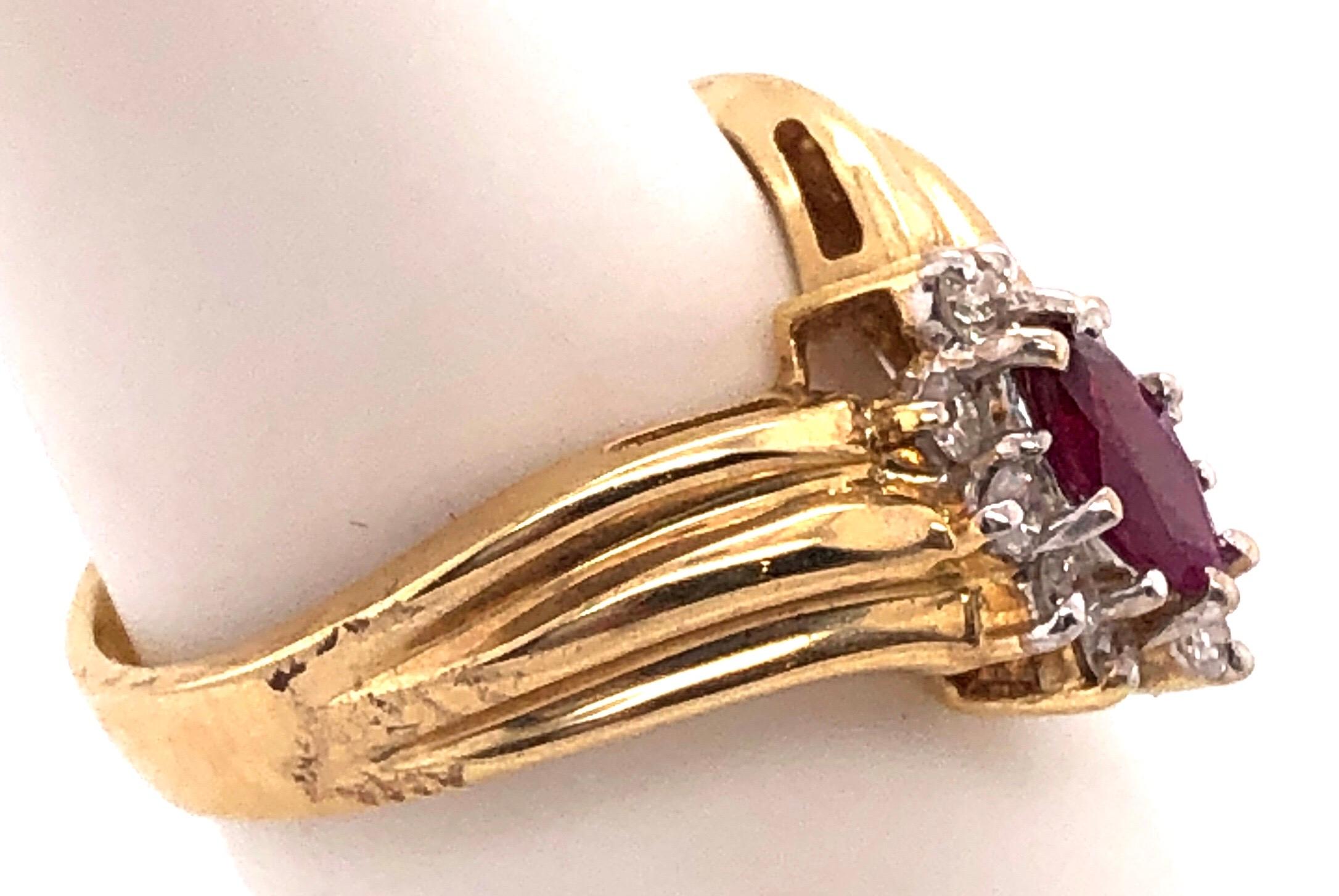 14 Karat Yellow and White Gold Ruby Ring with Diamond Accents 0.50 TDW In Good Condition For Sale In Stamford, CT