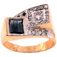 Anello contemporaneo in oro giallo e bianco 14 carati con zaffiro e diamante