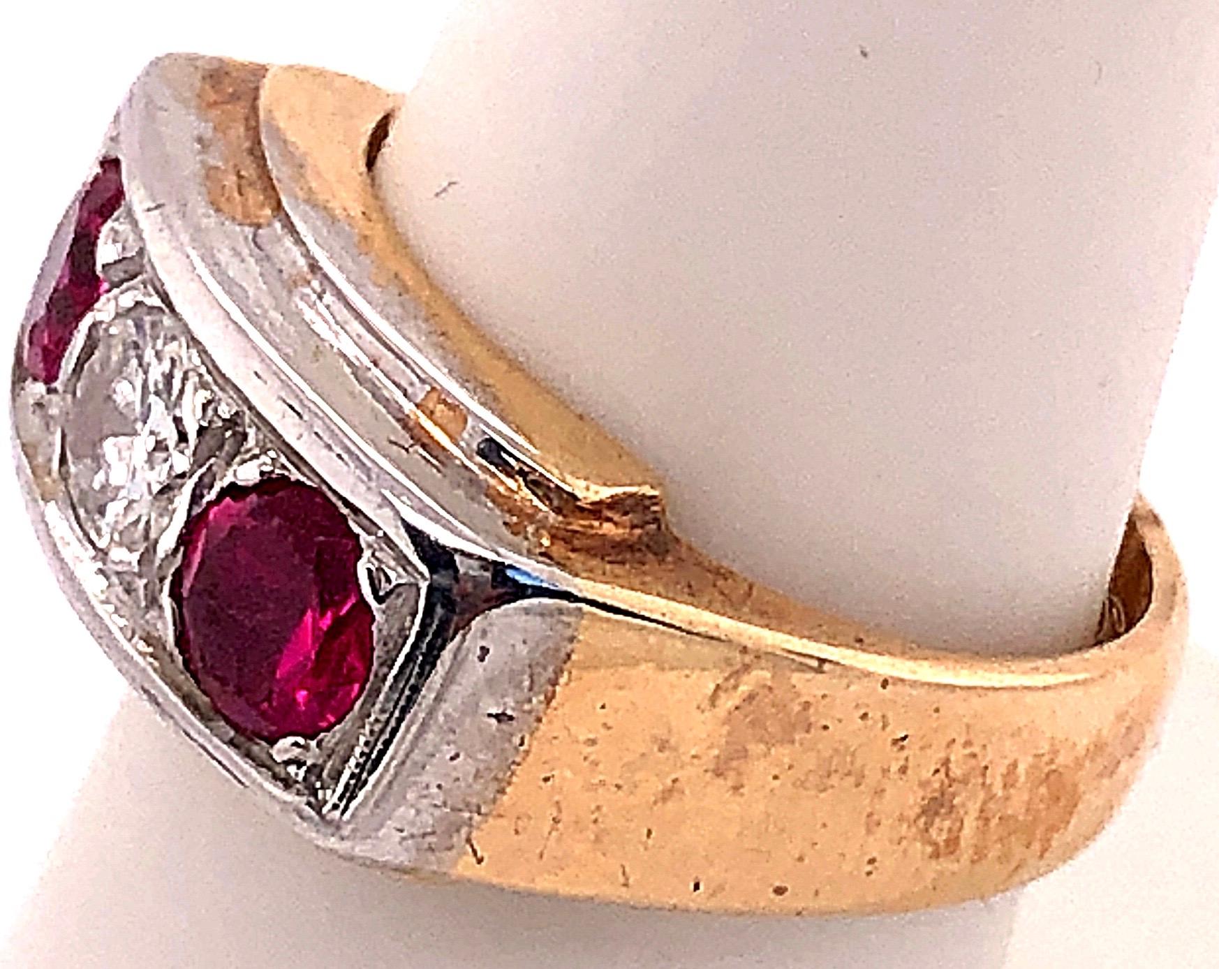 Round Cut 14 Karat Yellow and White Gold Three-Stone Diamond and Ruby Band Ring For Sale