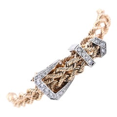 14 Karat Yellow and White Gold Twisted Buckle Bracelet