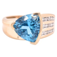 14 Karat Yellow Blue Topaz and Diamond Ring