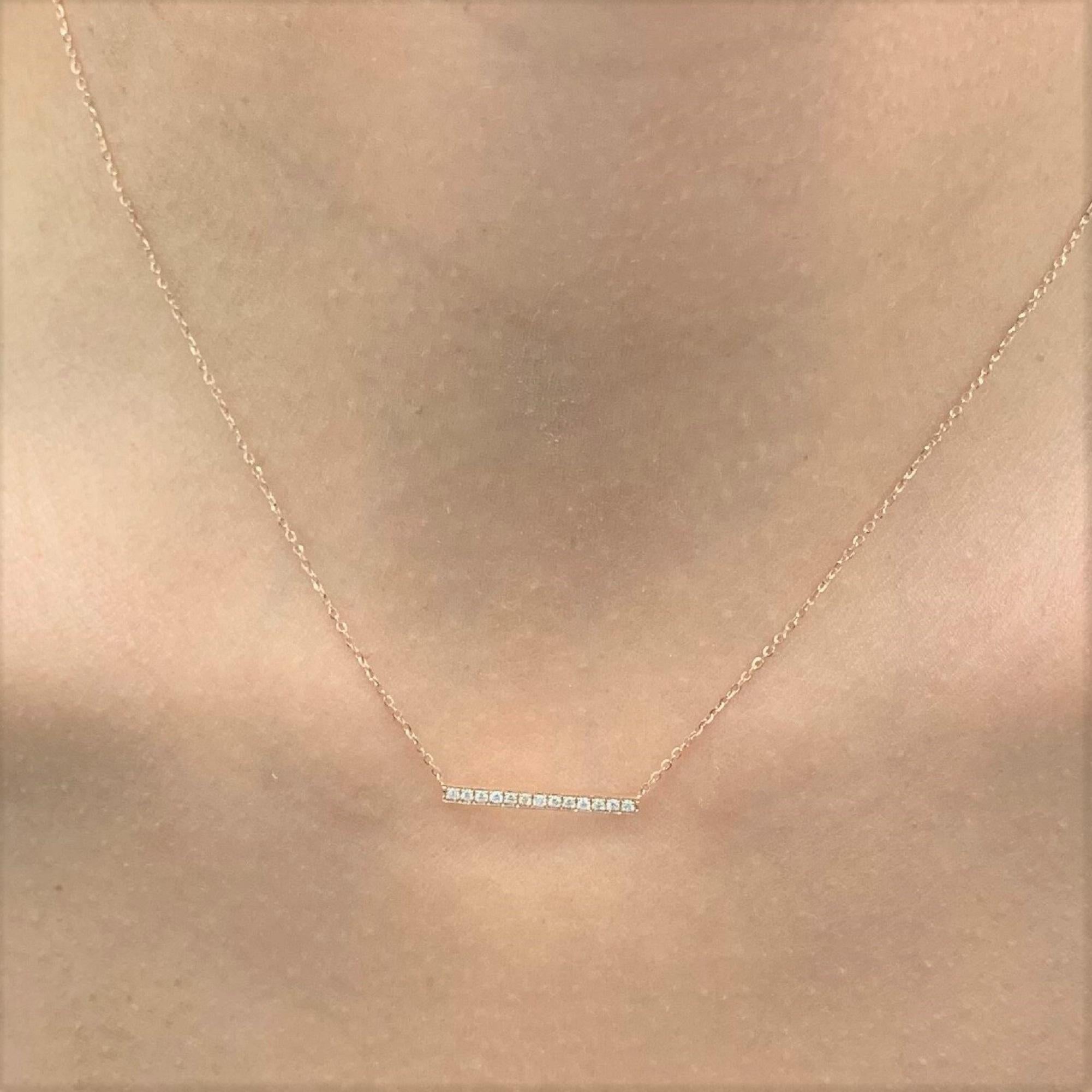 A beautiful and classic 14k Gold Diamond Bar Necklace featuring 0.10 ct. of round sparkling natural Diamonds. Diamond Color and Clarity is GH SI1-SI2. Chain measures 18