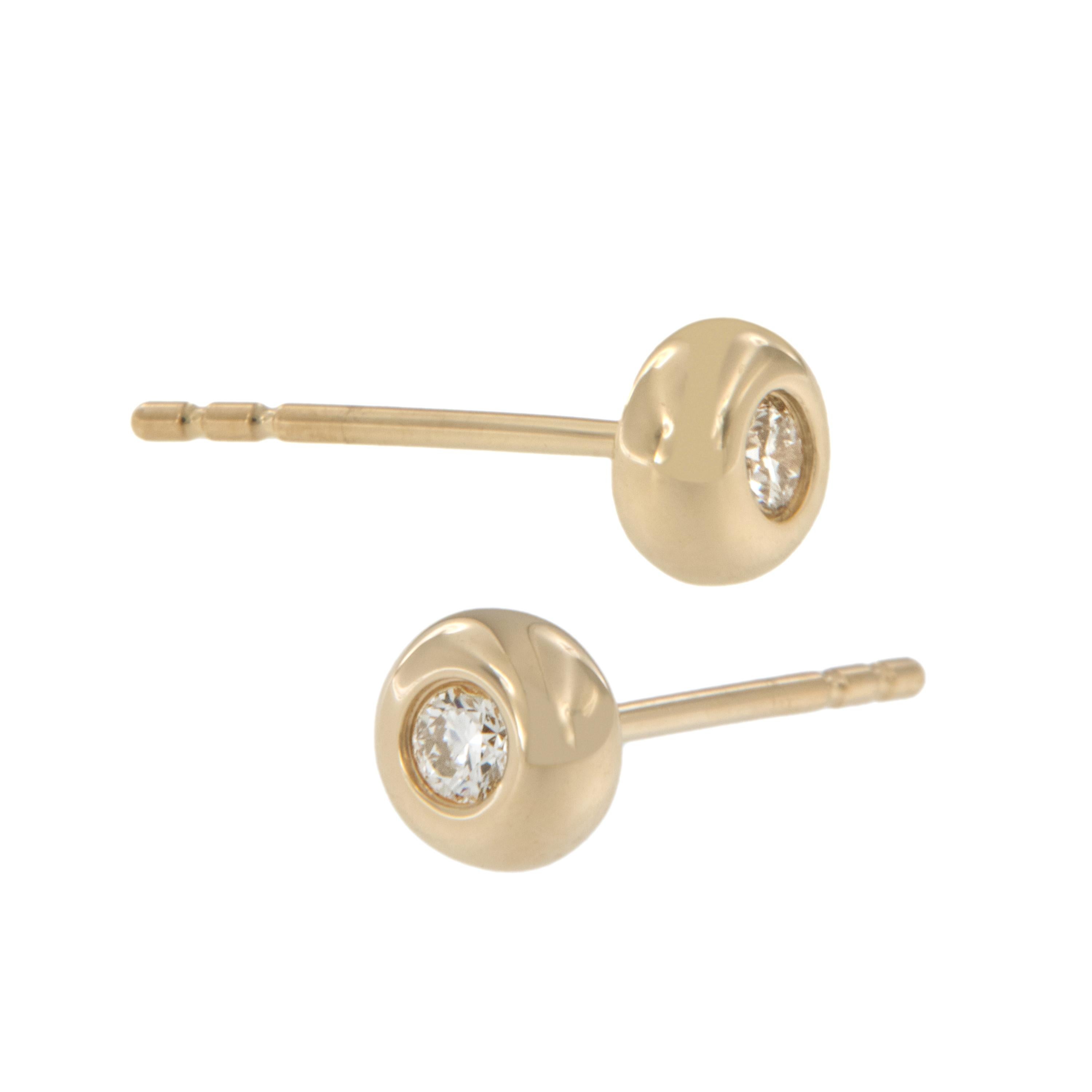 These are the perfect everyday earrings! Makes the ideal birthday, holiday, graduation gift. Made from 14 karat yellow gold, two round brilliant cut diamonds = 0.10 Cttw are expertly framed in puffy bezels with posts and friction backs for security