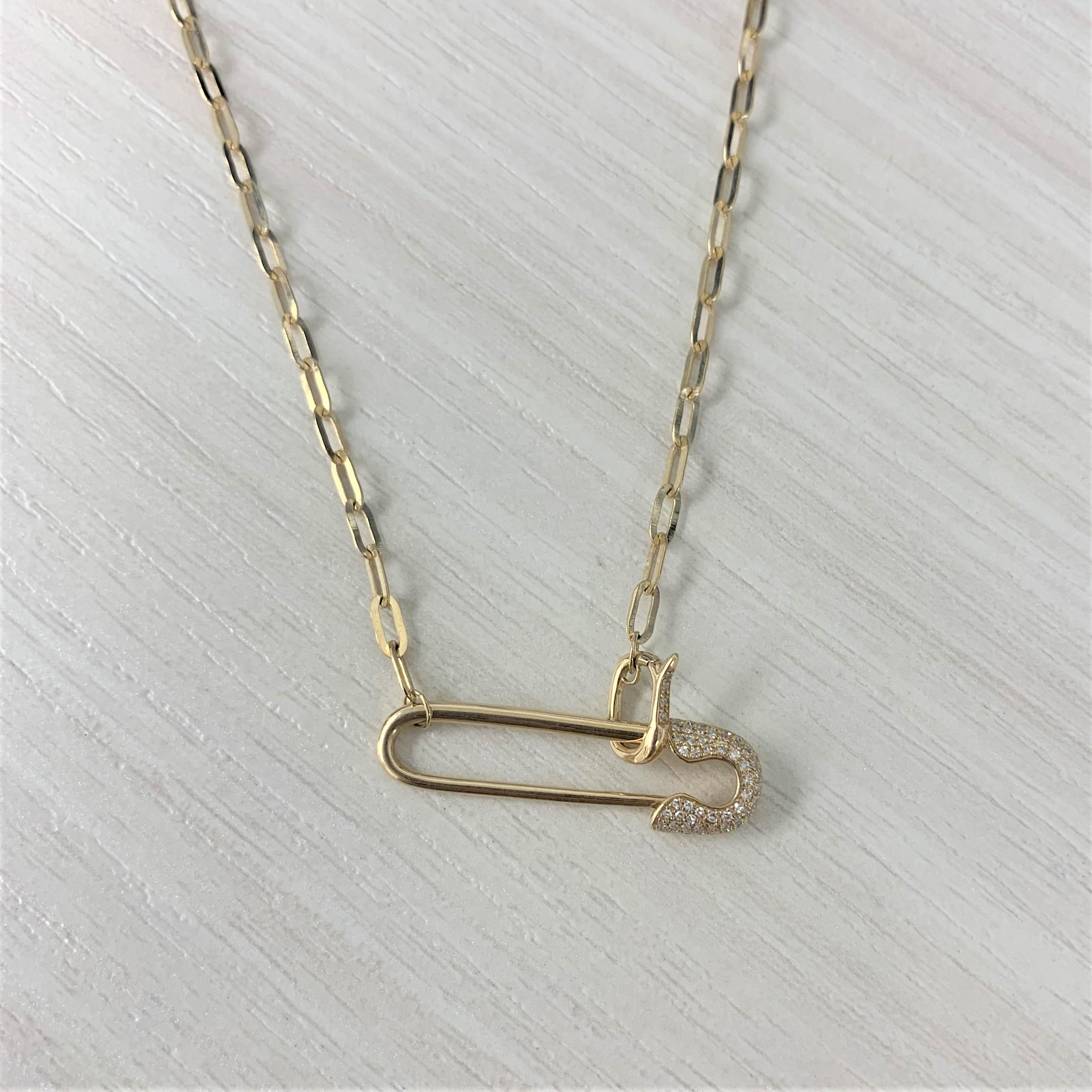 Add this Saftey Pin adorable necklace to your wardrobe to add that special glamour! Crafted of 14K Yellow Gold this neckalce features 0.12 carats of round natural white diamonds. Gold weight is 5.46 grams. Chain length is 18