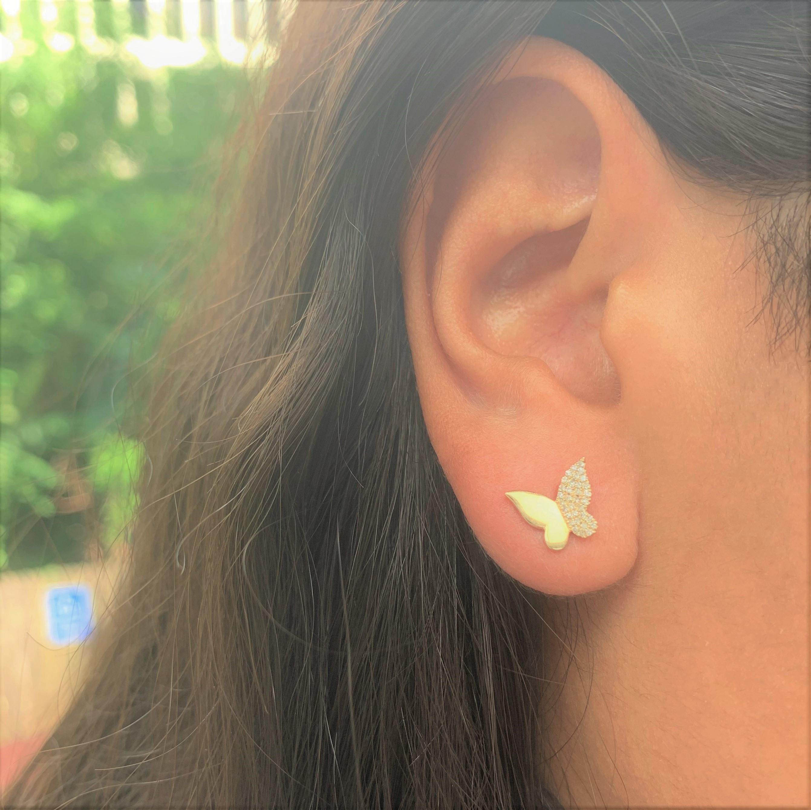 Ready to soar through the clear sky, a butterfly is both elegant and graceful. These sweet earrings feature fluttering wings filled with 0.17 ct. of round diamond accents, which connect to a smooth 14k yellow gold body. Take flight with these