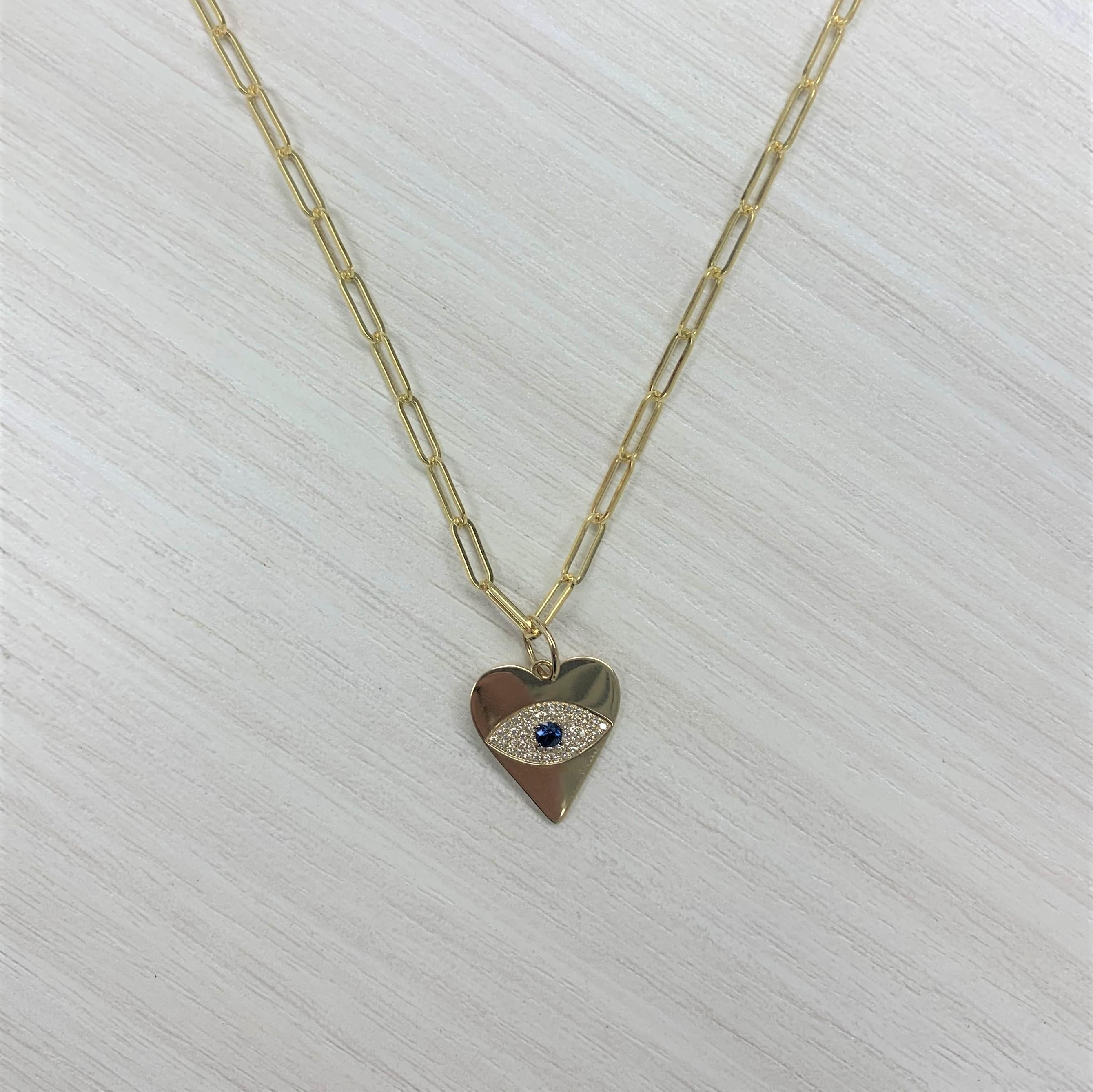 Made to inspire you to have strength and protection, this Evil Eye symbol makes every day your lucky day! Crafted of 14K Yellow gold this Heart necklace features 0.18 carats of natural round White Diamonds and 0.16 carats of Blue Sapphires, this