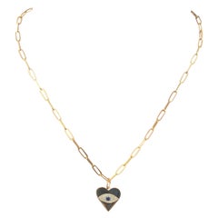 Collier cœur Evil Eye en or jaune 14 carats avec diamants et saphirs de 0,18 carat