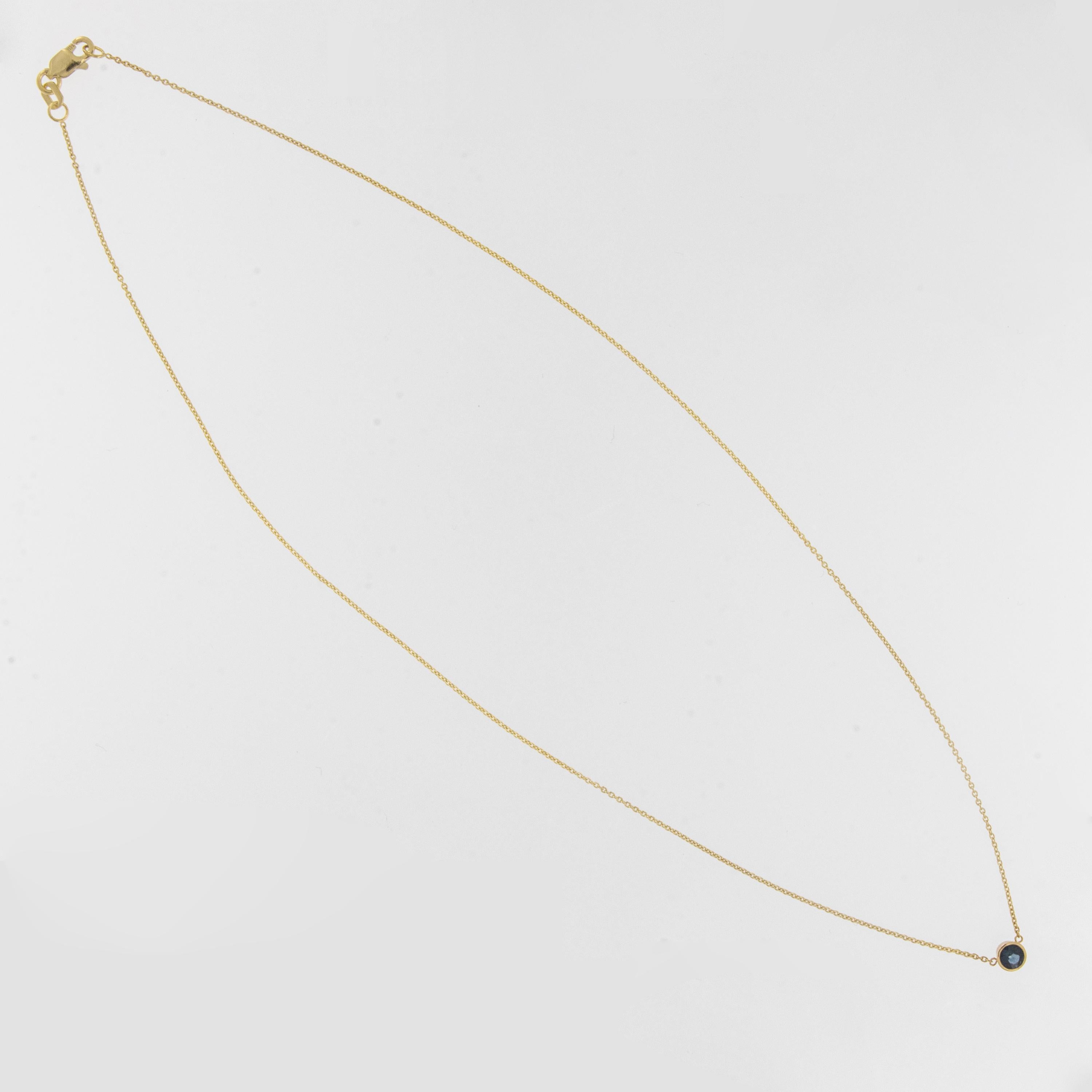 This timeless and sweet necklace will look lovely around your neck! Made from 14 karat yellow gold and encasing a fine blue round sapphire = 0.29 carat this solitaire necklace is 16