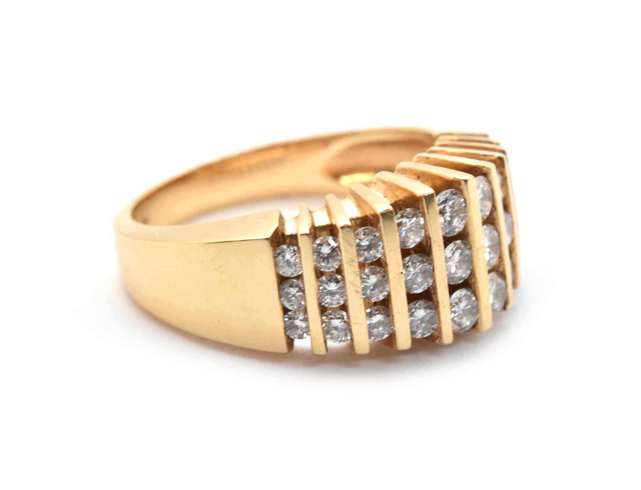 This ring is made in solid 14k yellow gold, and the face of the ring holds 10 rows of round diamonds. The diamonds have a total weight of 0.75 carats, and they are graded G-H in color and SI in clarity. The ring measures 9mm wide. The ring weighs
