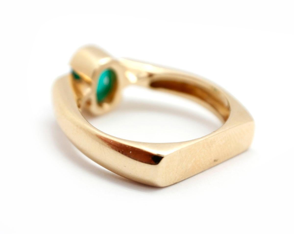 Oval Cut 14 Karat Yellow Gold, 0.75 Carat Emerald and 0.17 Carat Diamond Ring