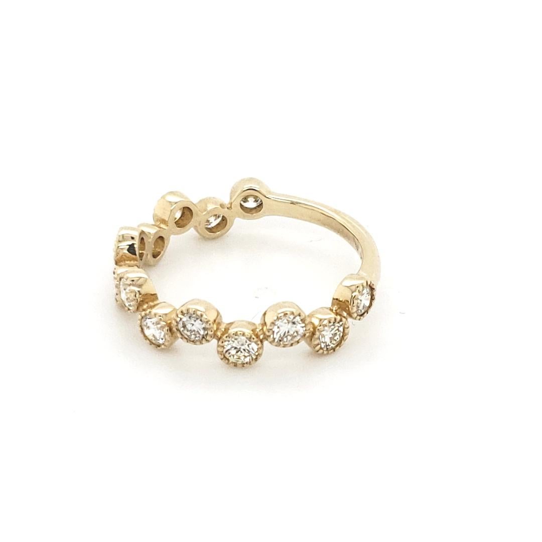14 Karat Yellow Gold Round Cut Natural Diamond Stackable Bezel Set Ring with 13 round cut natural diamonds with a total weight of 0.95 Carats in individual alternating bezel setting.

Perfect piece of jewelry to match any outfit, and sturdy for