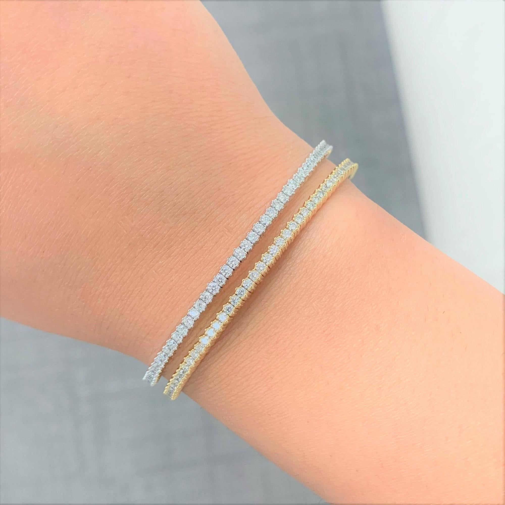 Crafted of 14K Gold this Gorgeous and Classic Diamond Single Row Bangle features 1 carat of round Diamonds. Color and Clarity is GH-SI. One of the Best-Sellers of the Joelle Collection! This bangle is available in White & Yellow Gold. This bangle