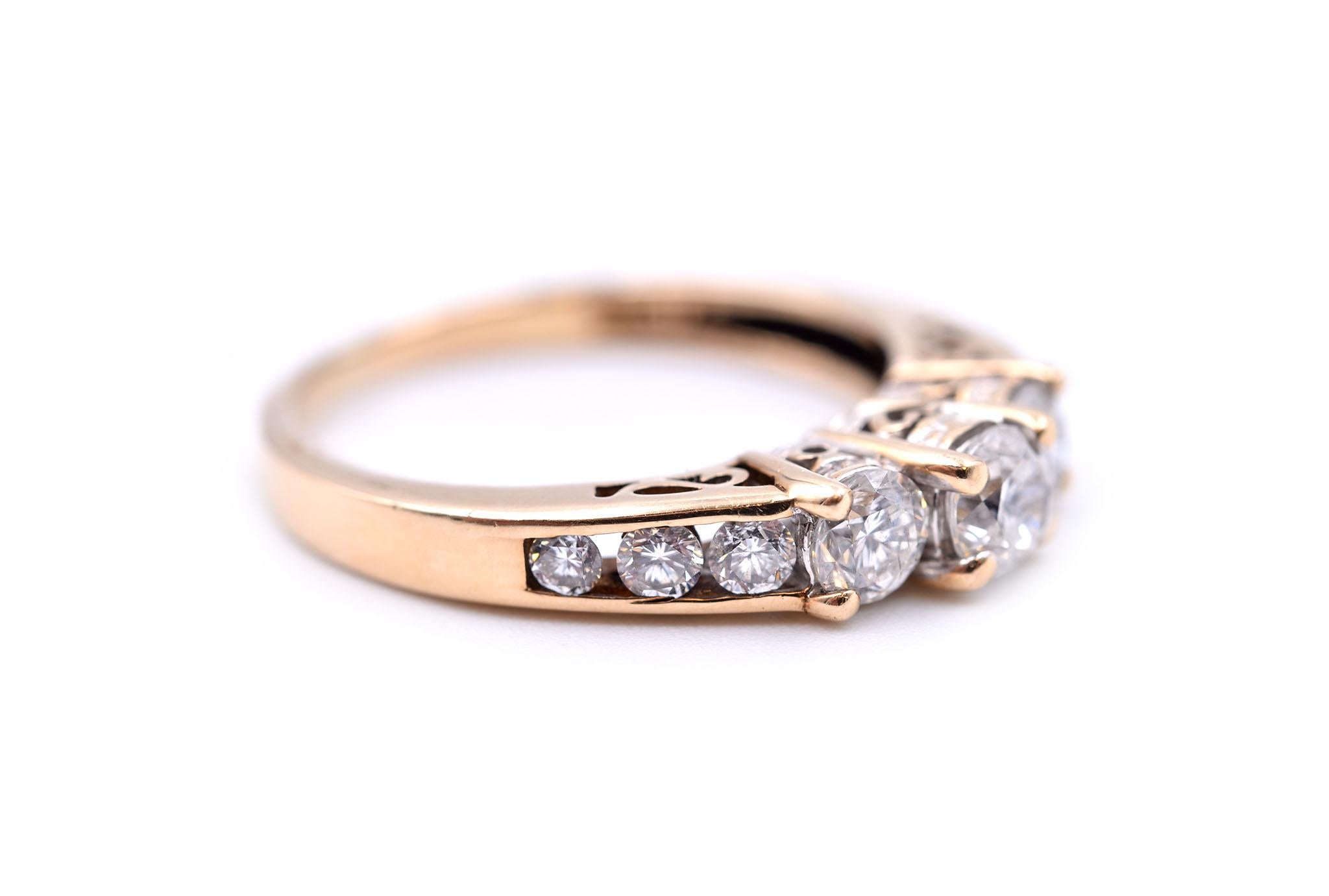 Designer: custom design
Material: 14k yellow gold
Diamonds: nine round brilliant cut = 1.00 carat total weight.
Color: H
Clarity: SI1
Ring size: 7 (please allow two additional shipping days for sizing requests)
Weight: 3.39 grams 

