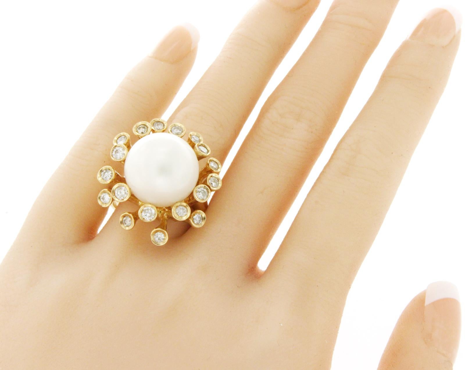 Top: 25 mm
Band Width: 3.5 mm
Metal: 14K Yellow Gold 
Size: Message us for size
Hallmarks: 14K
Total Weight: 15.6 Grams
Stone Type: 15 mm South Sea Pearl & 1.10 CT G SI2 Diamonds
Condition: New
Estimated Retail Price: $4200
Stock Number: RF