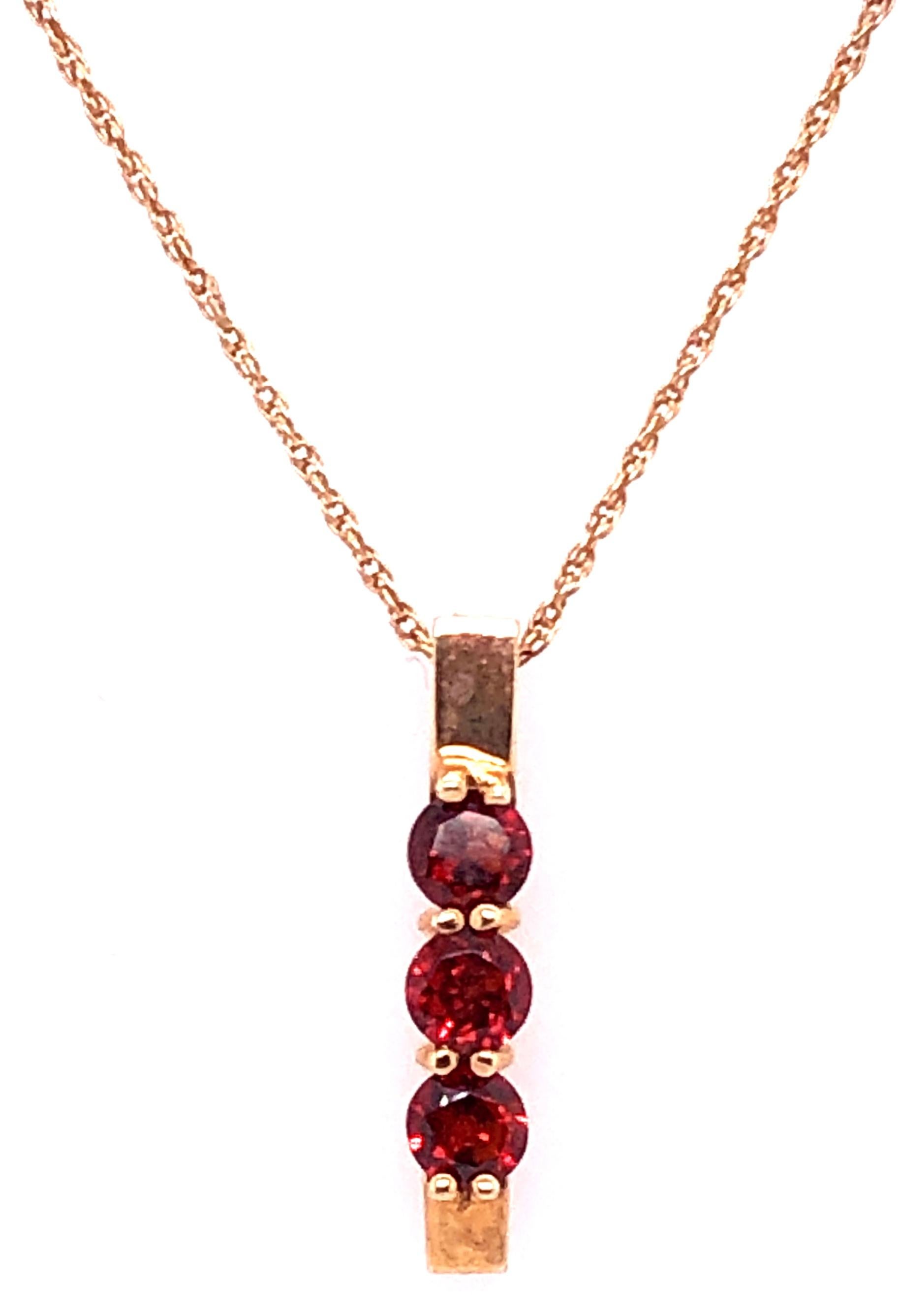 14 Karat Yellow Gold 16 Inch Necklace with Three Round Garnet Pendant.
1.17 grams weight of pendant. Garnets approx .25 Carats each. 
2.5 grams total weight
Stamped NY Co 14K