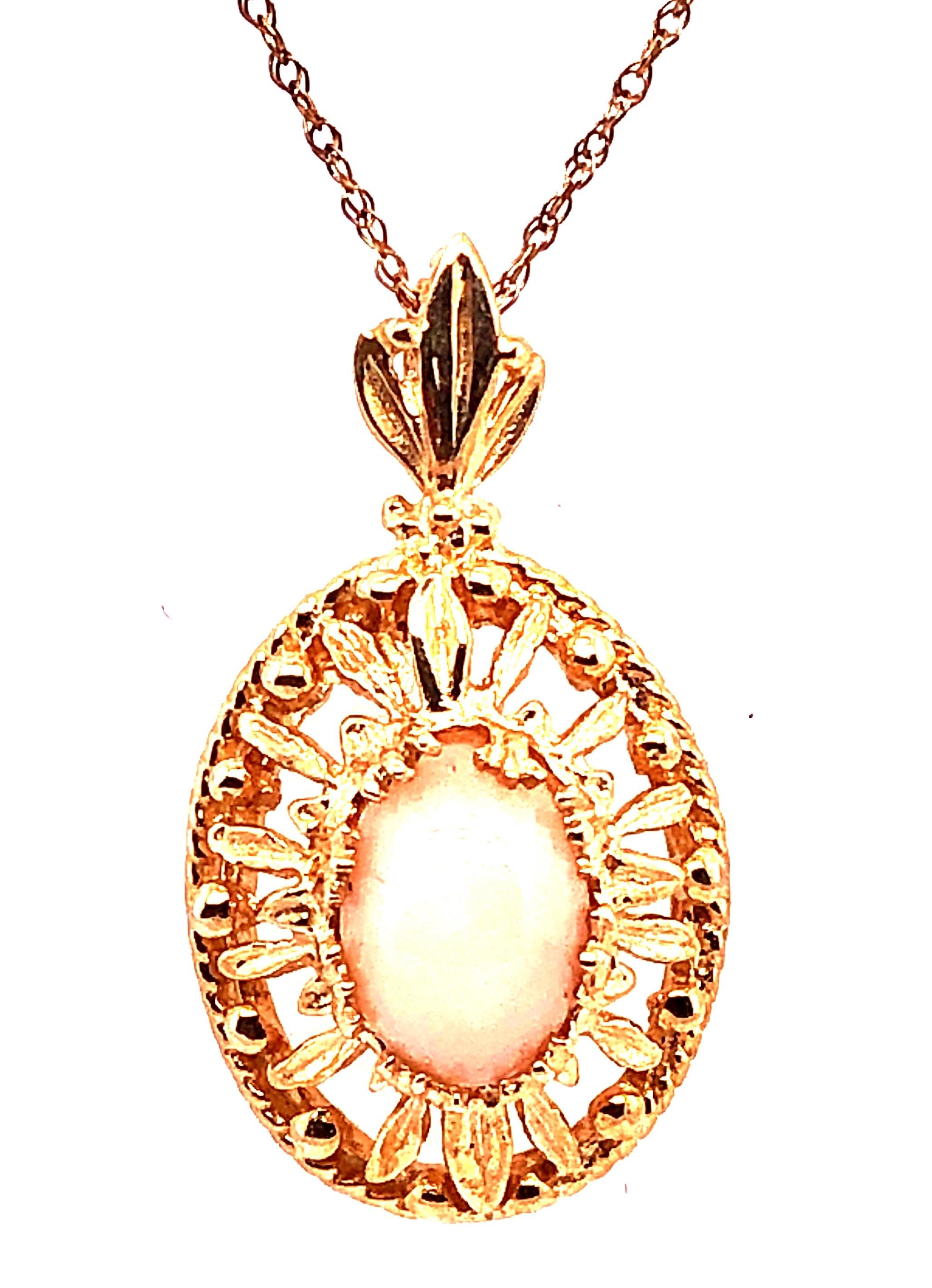 14 Karat Yellow Gold 18 Inch Necklace with Pendant. Stone, most likely Rose Quartz is 7.75mm by 6mm. 
3.68 grams total weight. Pendant stamped 14K