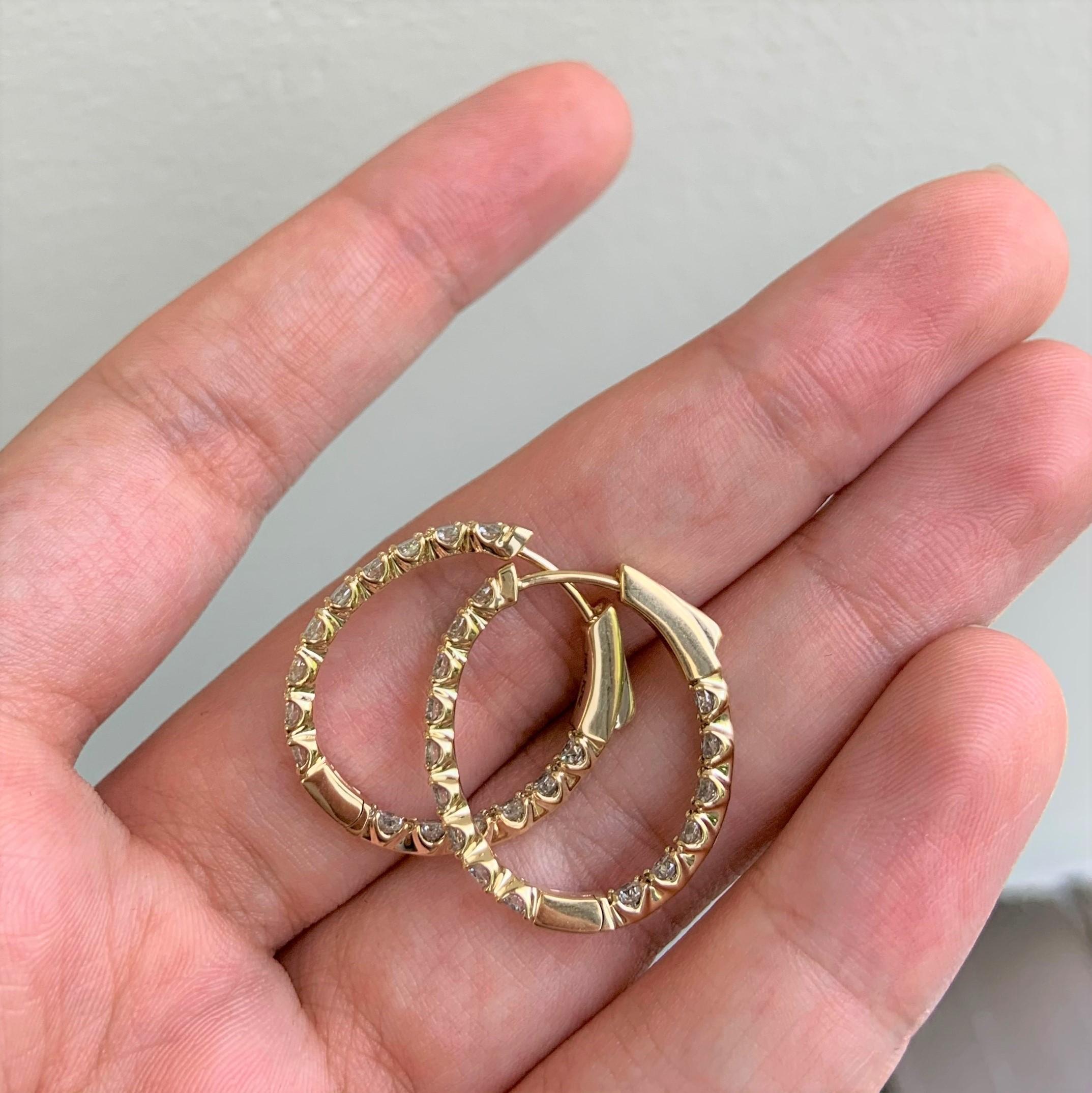 These Classic and Elegant Diamond Oval Hoop Earrings will frame your face beautifully! Crafted of 14K Yellow Gold these earrings feature approximately 1.91 cts of Natural Round Diamonds. Diamond Color and Clarity is GH-SI1. Insert Latch for