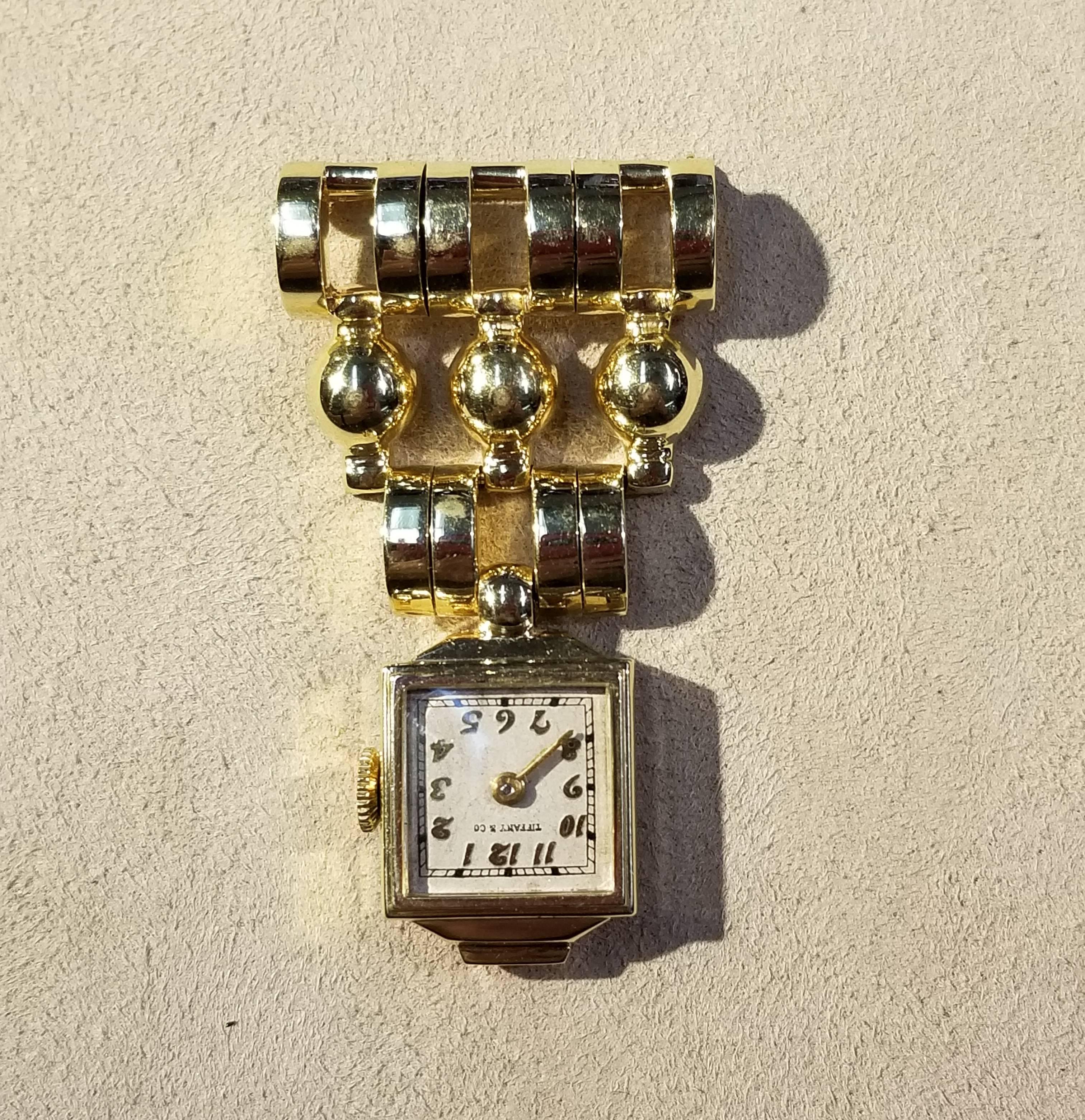 Tiffany Retro 1940's lapel watch in 14 karat yellow gold weighing 7.3 dwt.