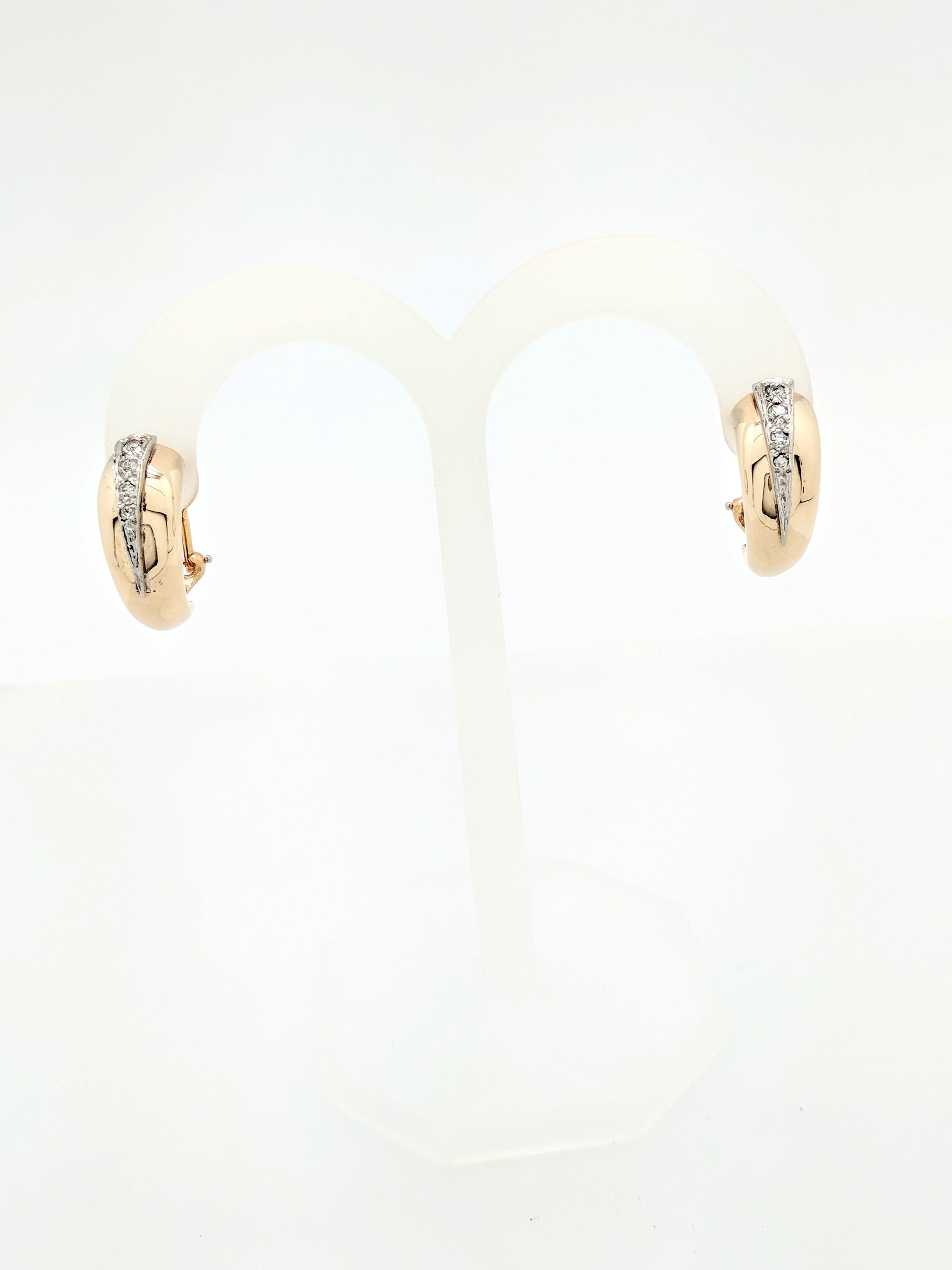 You are viewing a beautiful pair of ladies diamond half hoop leverback earrings. These earrings are crafted from 14k yellow gold and weigh 6.6 grams. They measures 21mm in length and 8mm in width. Each earring features (4) natural round brilliant
