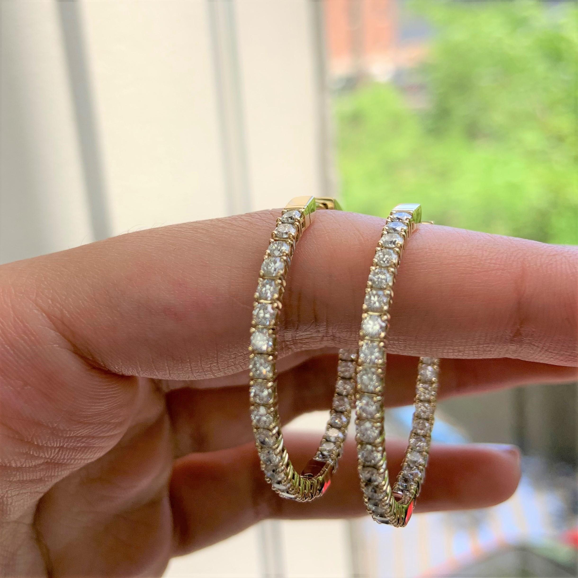 These Classic and Elegant Diamond Oval Hoop Earrings will frame your face beautifully! Crafted of 14K Yellow Gold these earrings feature approximately 2.77cts of Natural Round Diamonds. Diamond Color and Clarity is GH-SI1. Insert Latch for