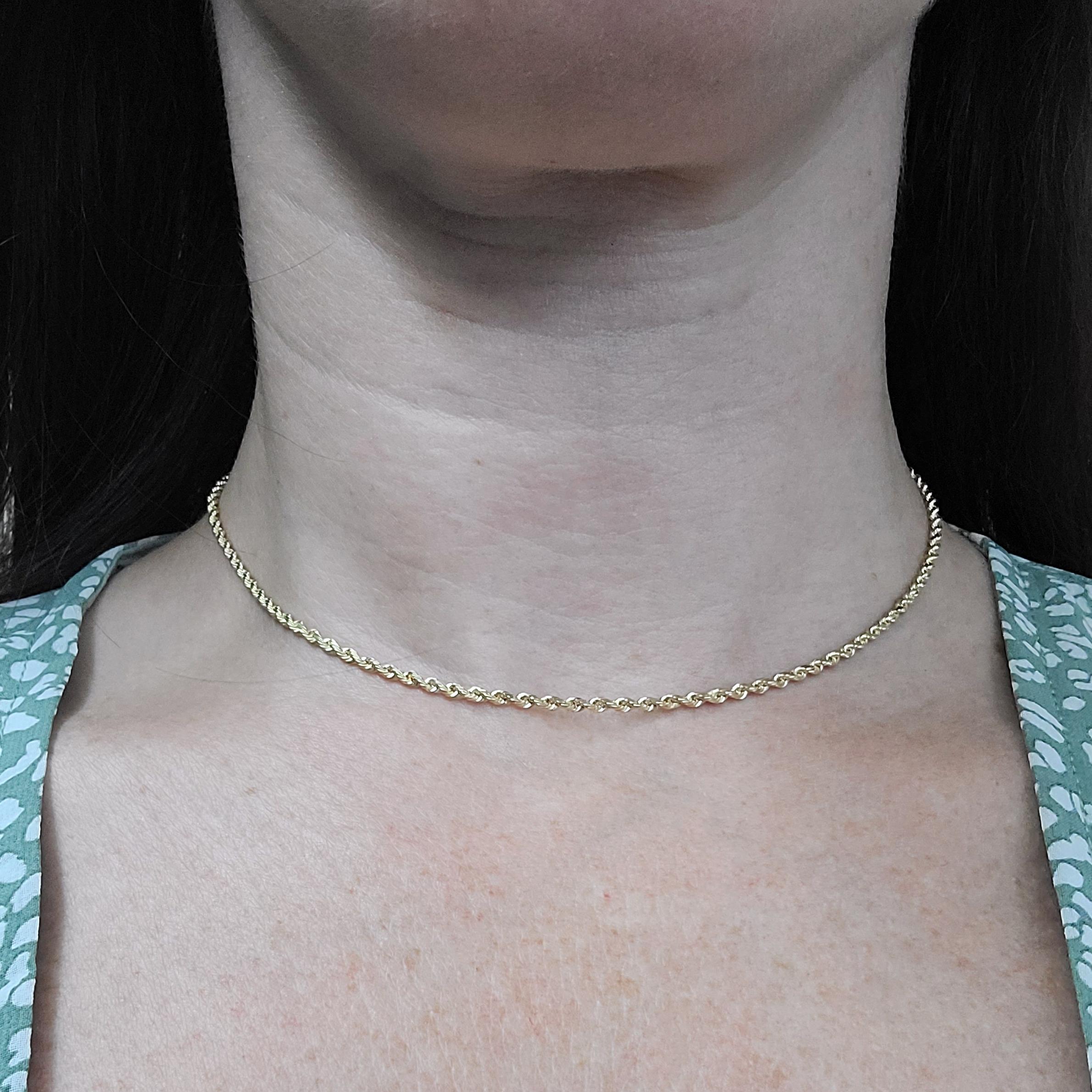 14 Karat Yellow Gold 2mm Rope Chain Choker Necklace Measuring 13 Inches Long With Tube Clasp & Figure 8 Safety. Finished Weight Is 4.7 Grams.