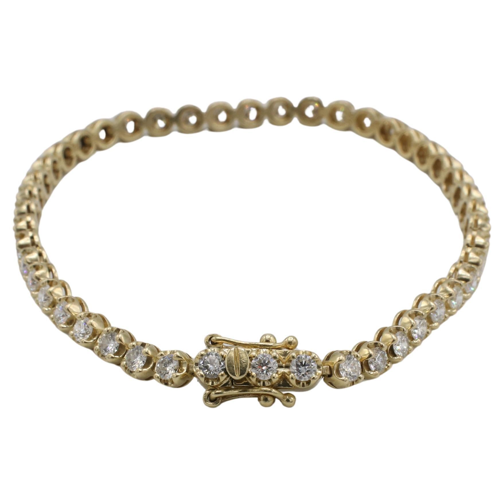 14 Karat Yellow Gold 3.00 Carat Natural Round Diamond Tennis Line Bracelet 
Metal: 14k yellow gold
Weight: 9.3 grams
Diamonds: 46 round natural diamonds, approx. 3.00 CTW H-I VS-SI
Length: 7 inches
Width: 3.7mm
SKU TTD 8539-3