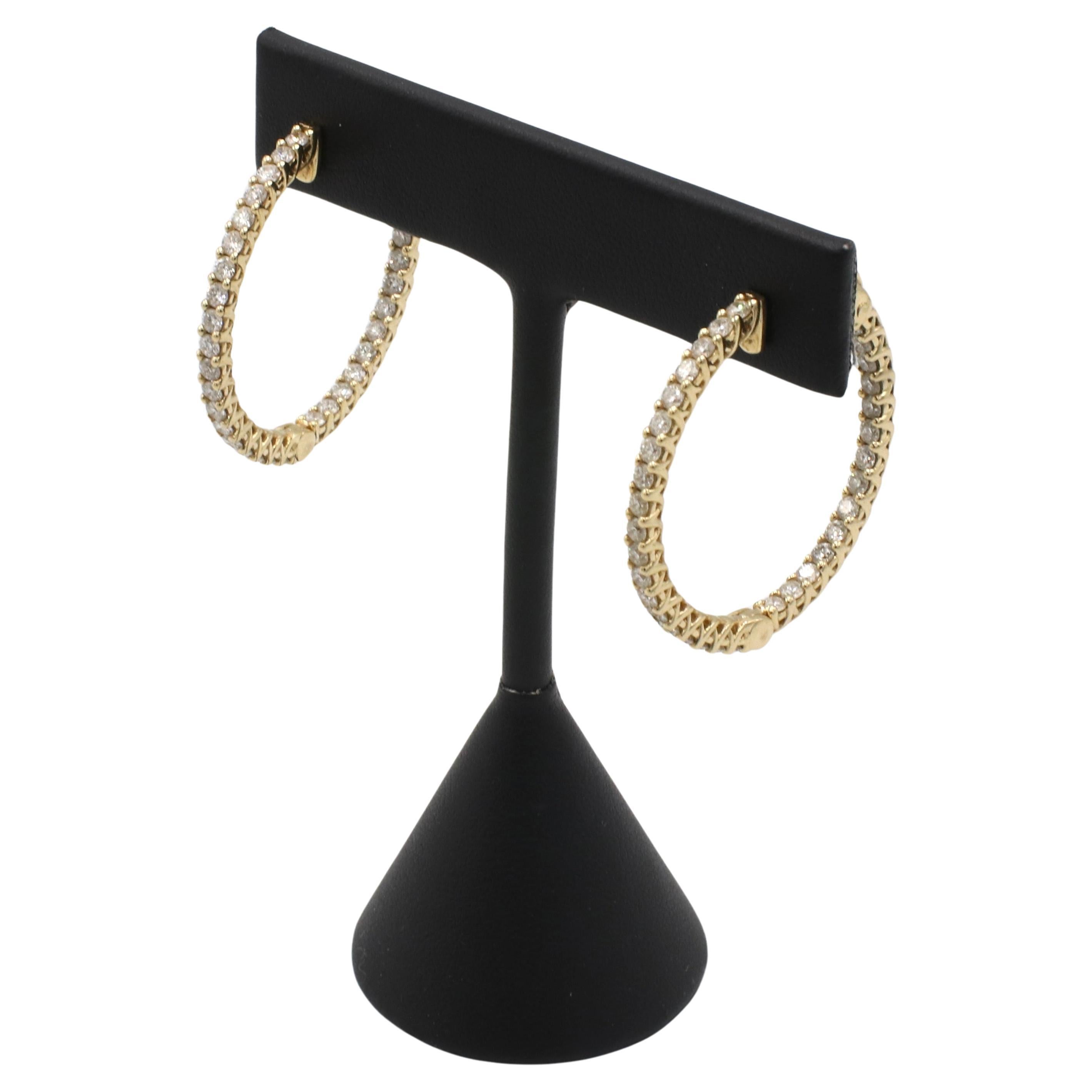 14 Karat Yellow Gold 3.30 Carat Natural Diamond Inside Outside Hoop Earrings 
Metal: 14k yellow gold
Weight: 10.7 grams
Diamonds: Approx. 3.30 CTW round H-I SI natural diamonds
Inside diameter: 28mm
Width: 2.8mm
KTD 111181-3
