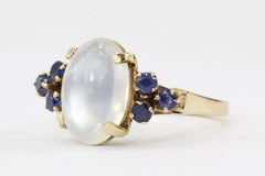 14 Karat Yellow Gold 4 Carat Moonstone and .24 Carat Blue Sapphire Ring