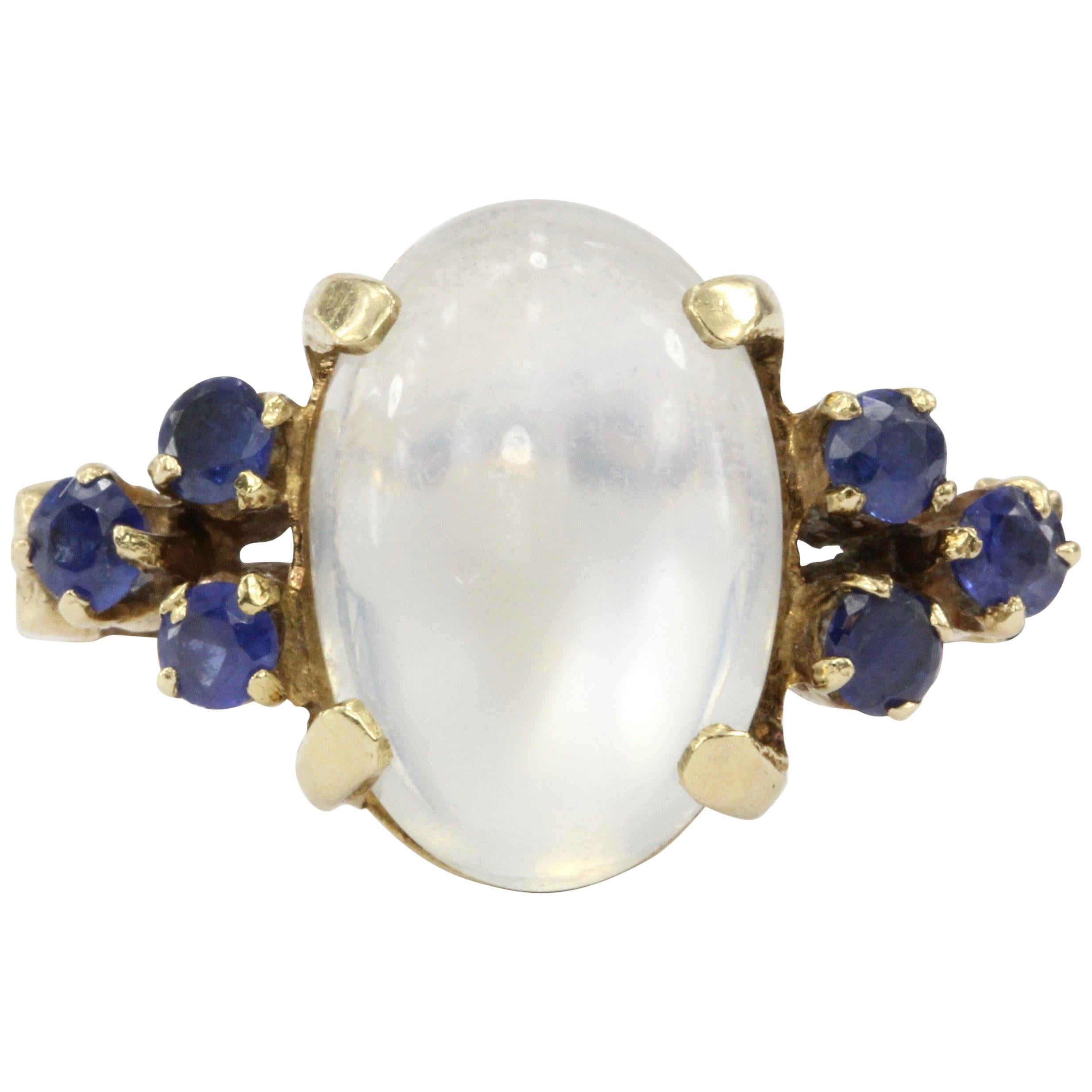 14 Karat Yellow Gold 4 Carat Moonstone and .24 Carat Blue Sapphire Ring