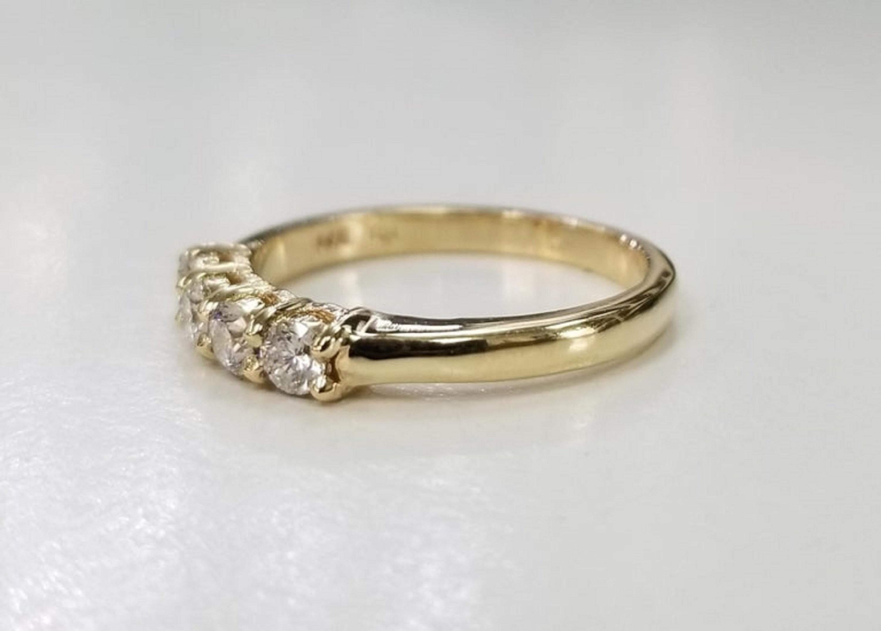14k yellow gold 4 diamond ring wedding anniversary ring .44pts., containing 4 round full cut diamonds of very nice quality weighing .44pts.  ring size is 7 and can be sized to fir for free.