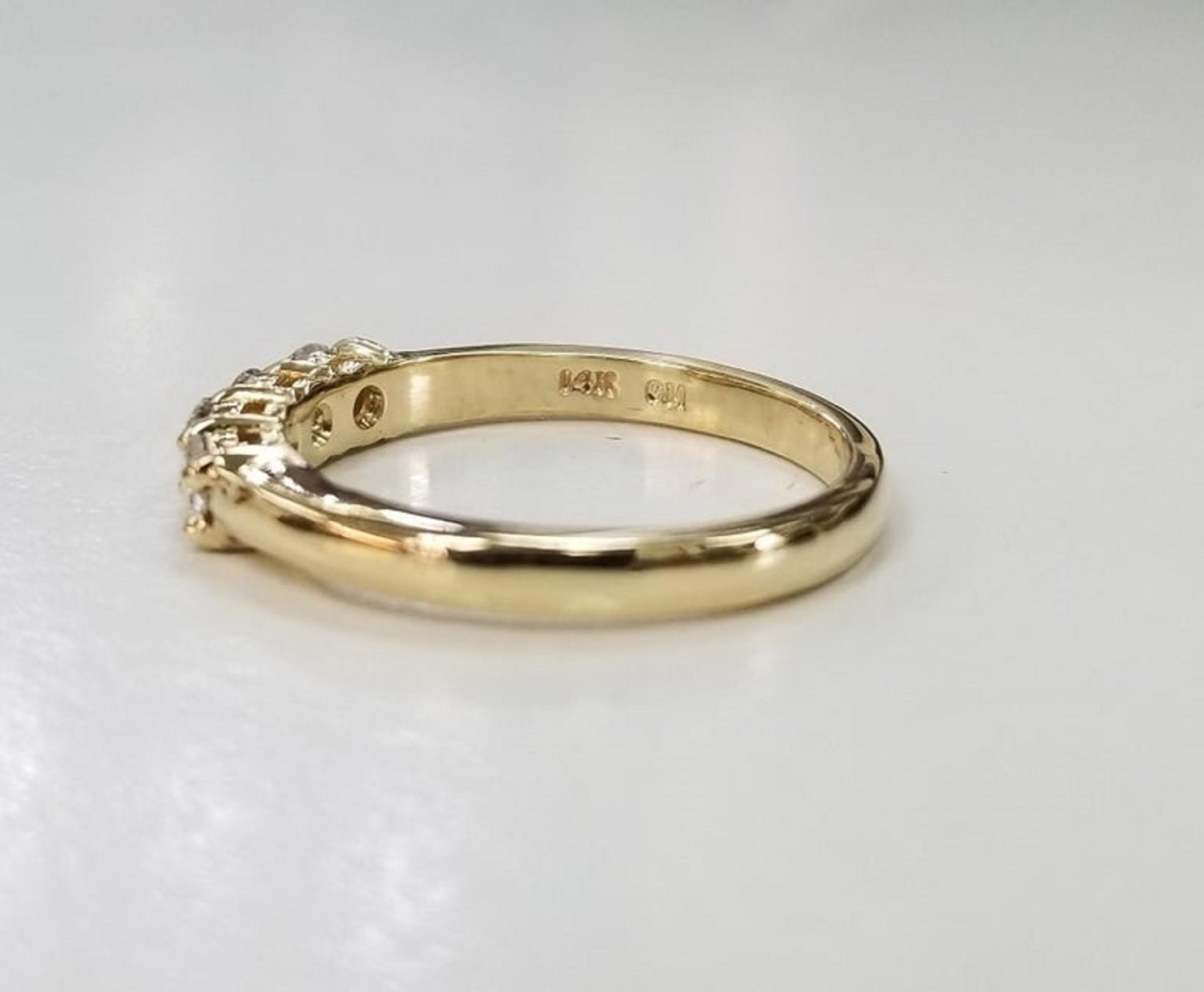 gold ring with 4 diamonds