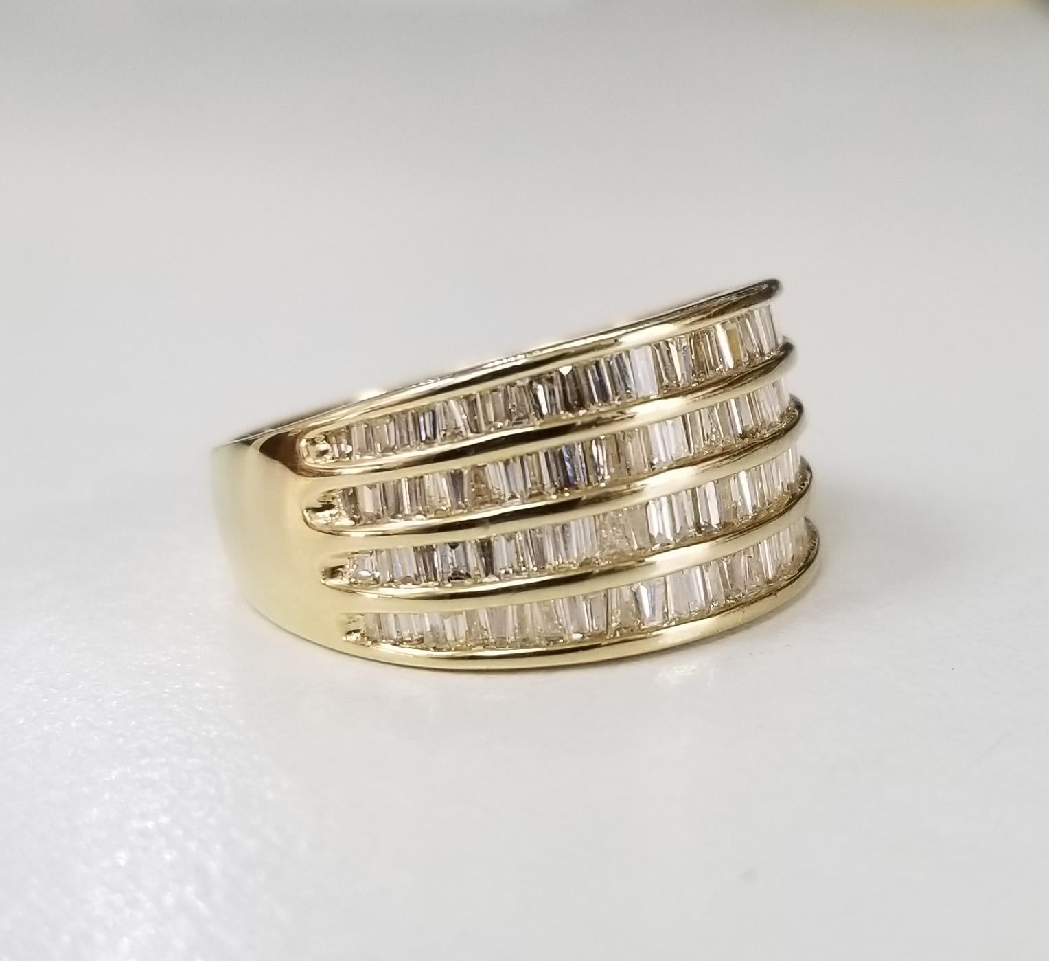 14 Karat Yellow Gold 4 Row Diamond Baguette Channel Set Ring at 1stDibs