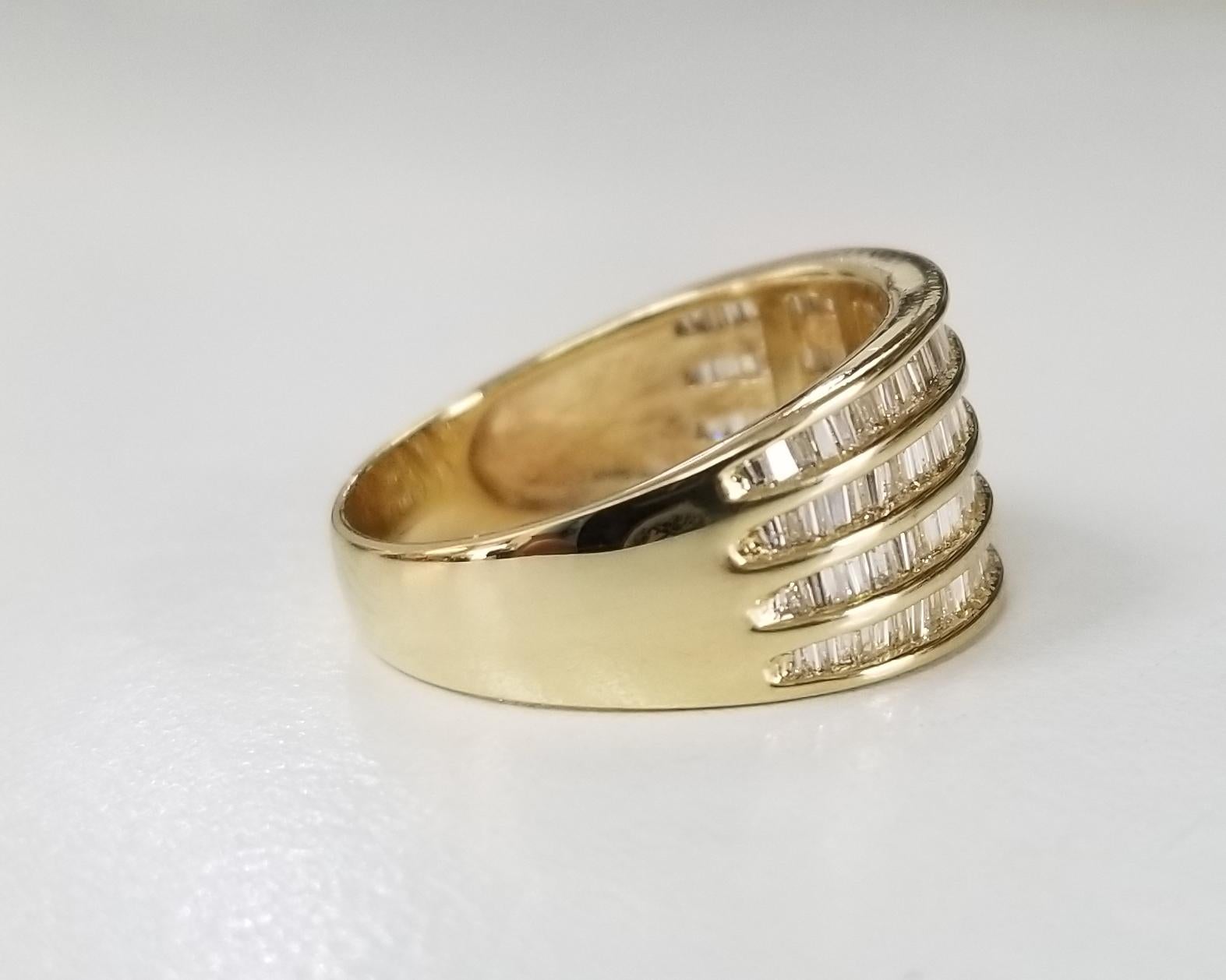 14 Karat Yellow Gold 4 Row Diamond Baguette Channel Set Ring at 1stDibs