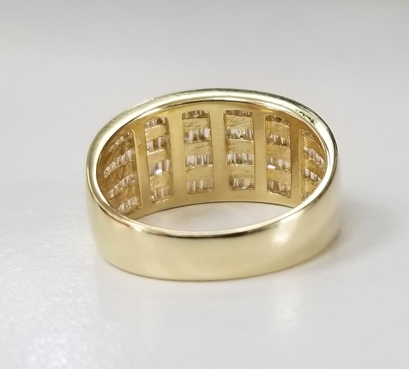 14 Karat Yellow Gold 4 Row Diamond Baguette Channel Set Ring at 1stDibs