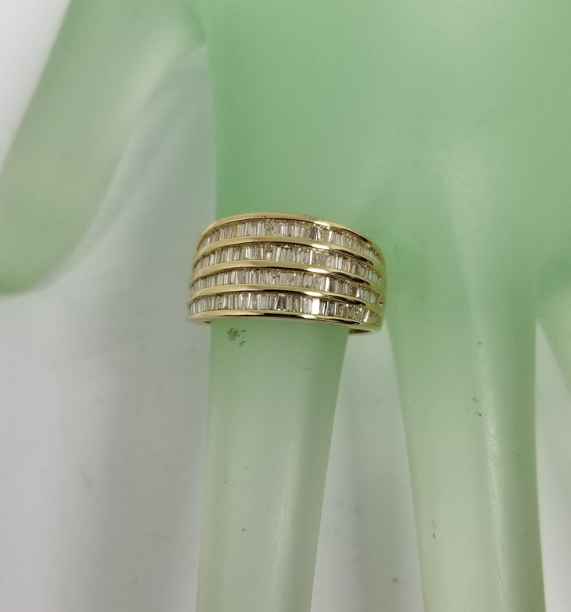 14 Karat Yellow Gold 4 Row Diamond Baguette Channel Set Ring at 1stDibs