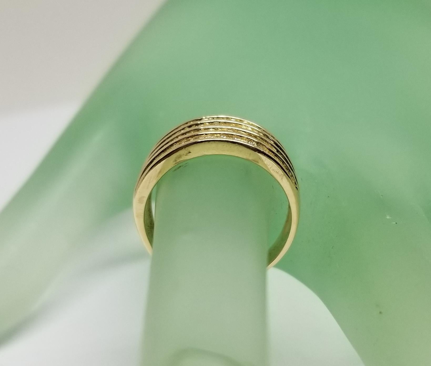 14 Karat Yellow Gold 4 Row Diamond Baguette Channel Set Ring at 1stDibs
