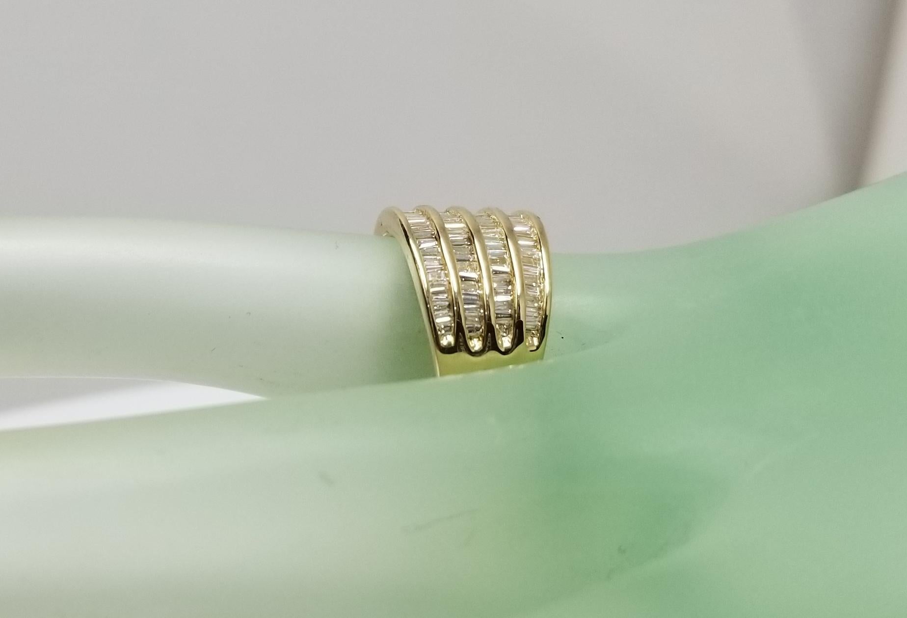 14 Karat Yellow Gold 4 Row Diamond Baguette Channel Set Ring at 1stDibs