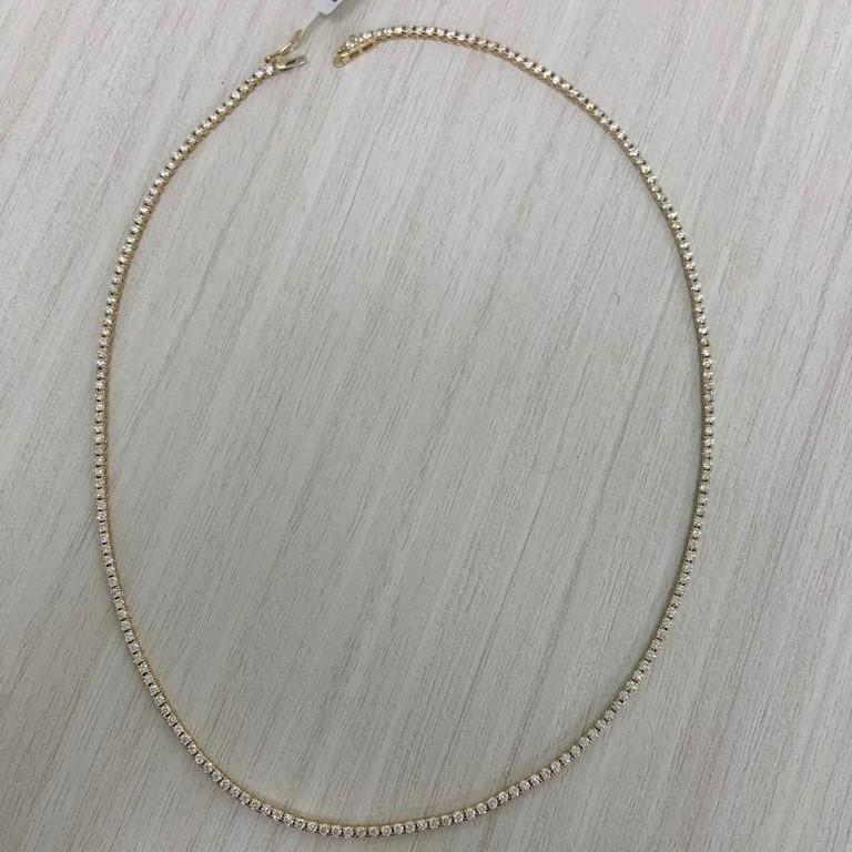 Add this Stunning and Elegant Diamond Tennis Line Necklace to your look! Crafted of 14K Yellow Gold this necklace features 193 Natural Round White Diamonds weighing 4.62 carats. Color & Clarity is GH_SI1. Insert Clasp Safety Closure. Length of