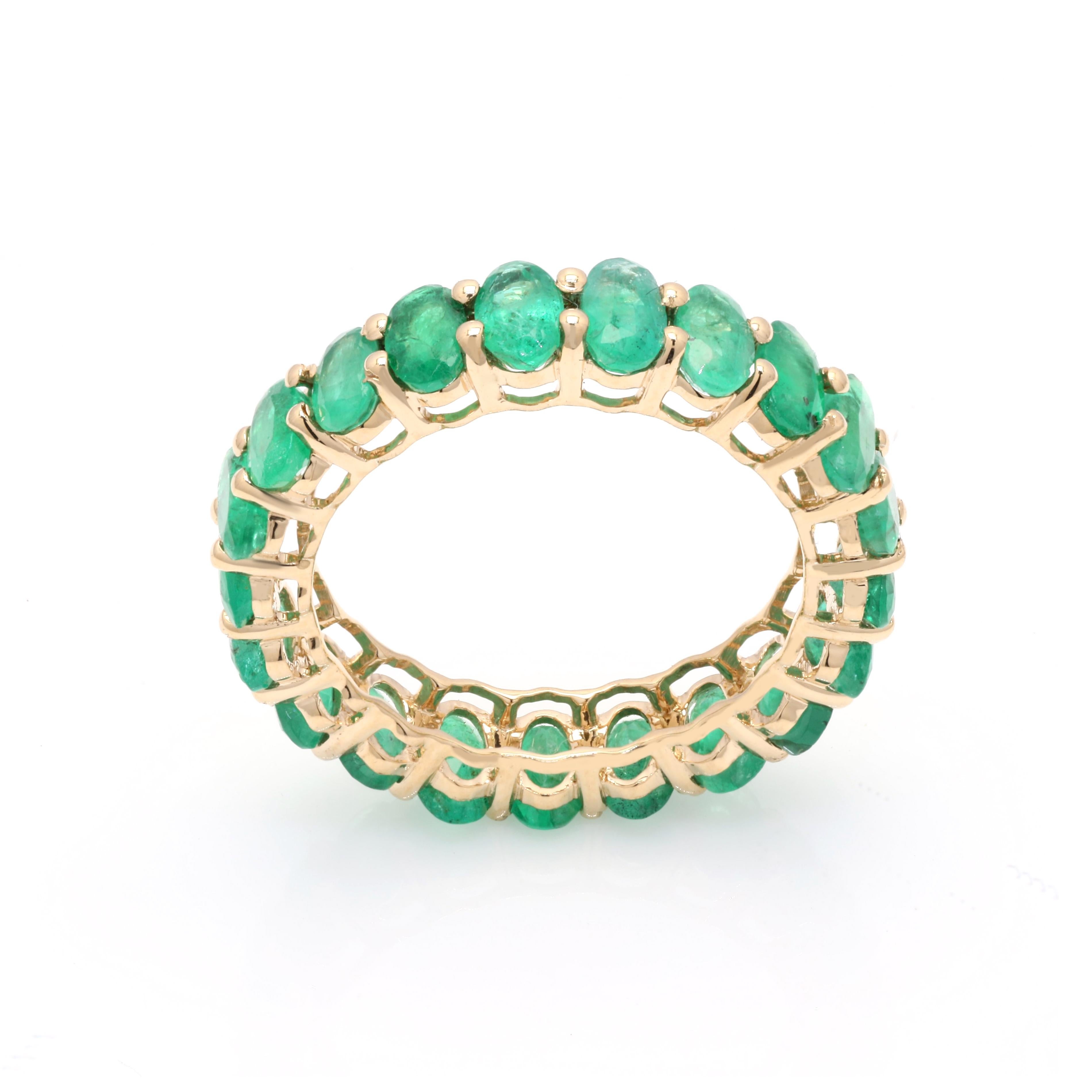 For Sale:  14 Karat Yellow Gold 4.63 ct Oval Cut Emerald Gemstone Eternity Band Ring 5