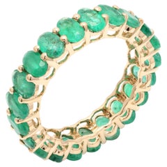 14 Karat Yellow Gold 4.63 ct Oval Cut Emerald Gemstone Eternity Band Ring