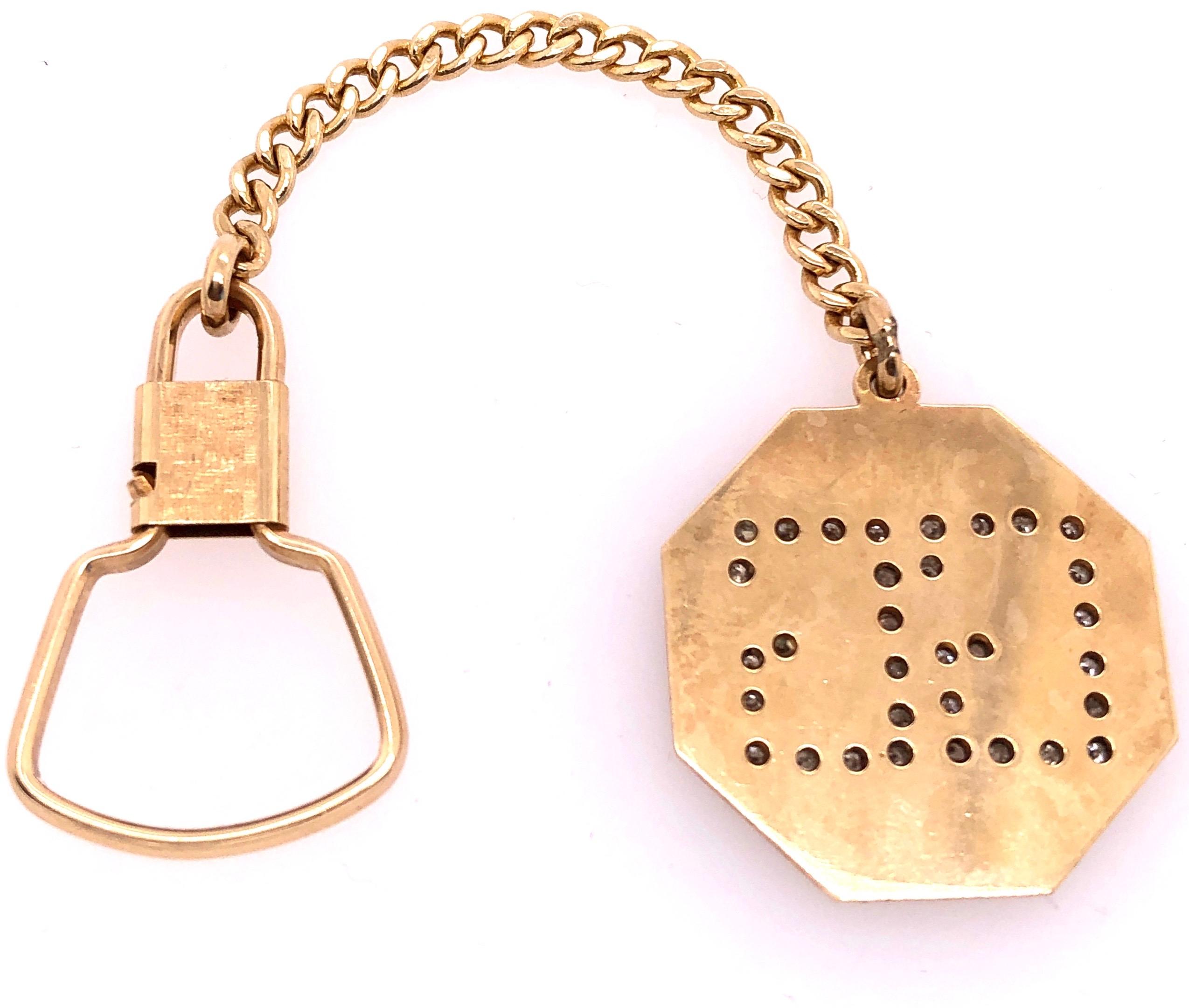 14 Karat Yellow Gold 5 inch Octagon Key Chain with Diamond Initials GG
Octagon Size: 28x28
14.1 grams total weight.
