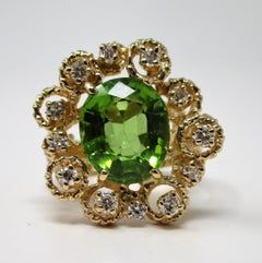 Anello in oro giallo 14 carati con peridoto e diamanti da 5,52 carati