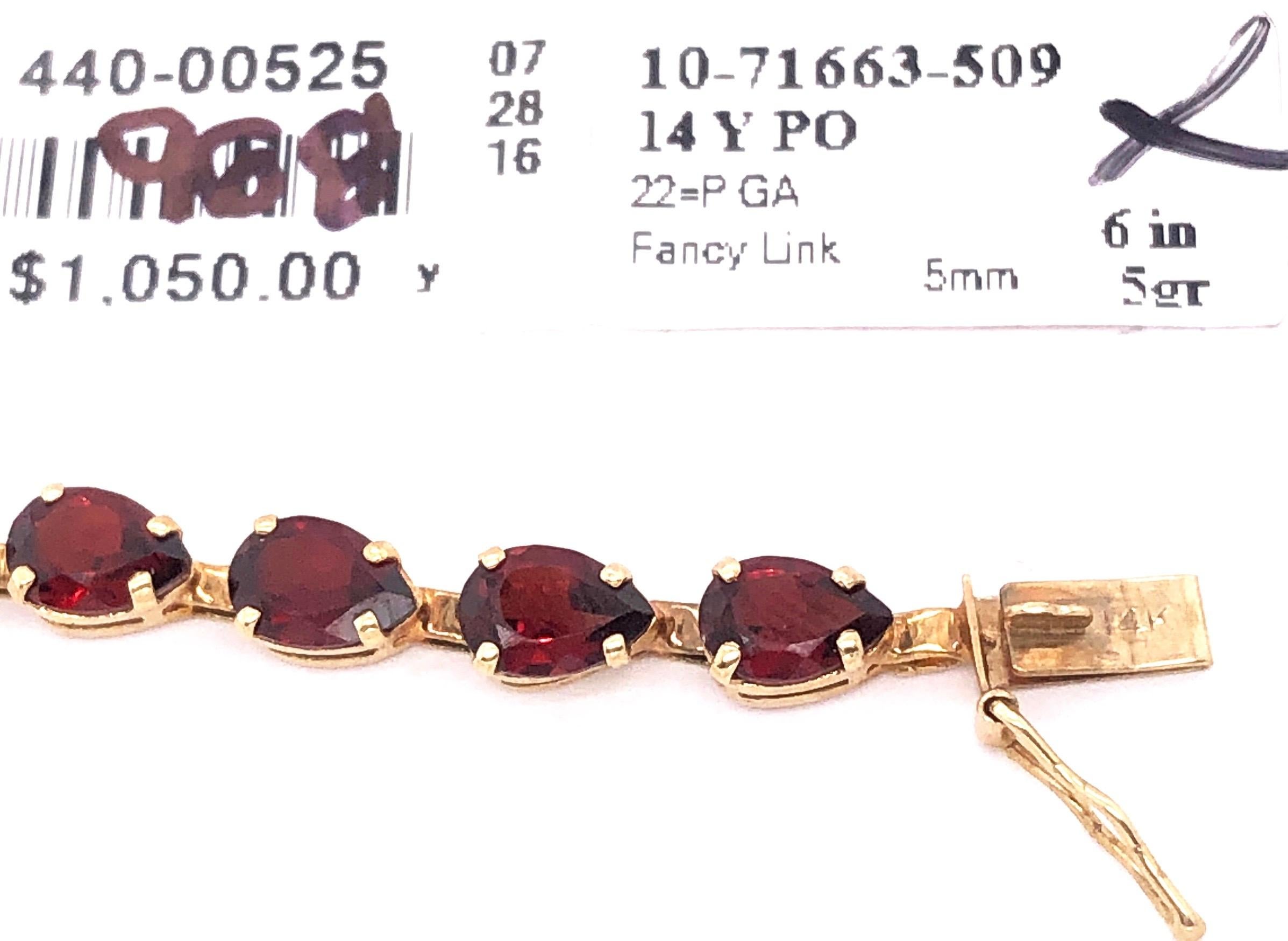 14 Karat Yellow Gold Fancy Link Garnet Bracelet Seven Inches Long In Good Condition For Sale In Stamford, CT