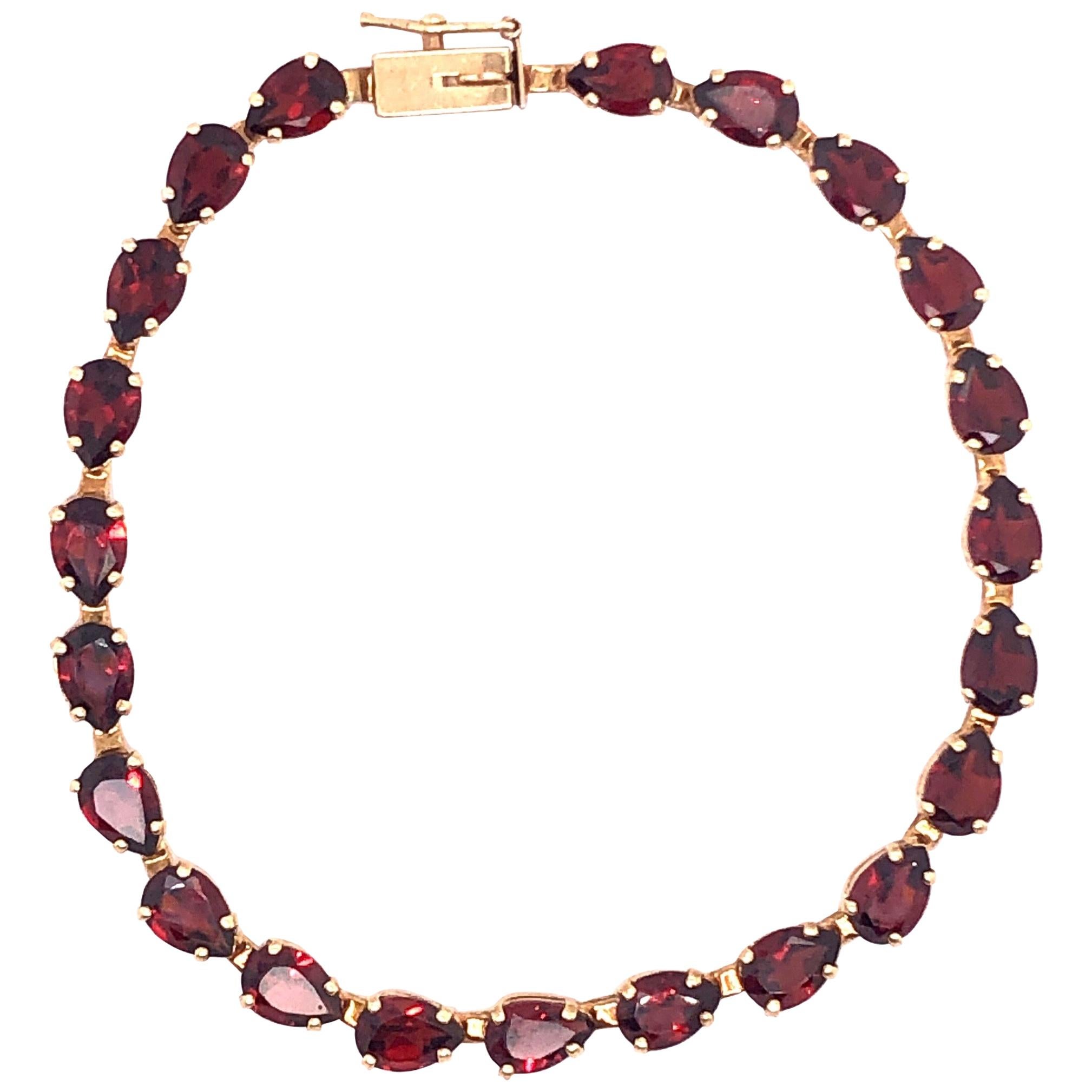 14 Karat Yellow Gold Fancy Link Garnet Bracelet Seven Inches Long